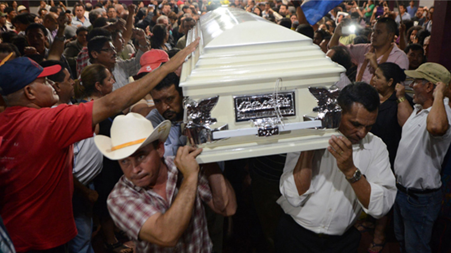 Relatives and friends carry the coffin of murdered indigenous activist Berta Caceres during her funeral in La Esperanza, 200 km northwest of Tegucigalpa, on March 3, 2016. Caceres, a respected environmentalist who won the prestigious Goldman Prize last year for her outspoken advocacy, was murdered in her home Thursday, her family said. AFP PHOTO /ORLANDO SIERRA / AFP / ORLANDO SIERRA (Photo credit should read ORLANDO SIERRA/AFP/Getty Images)