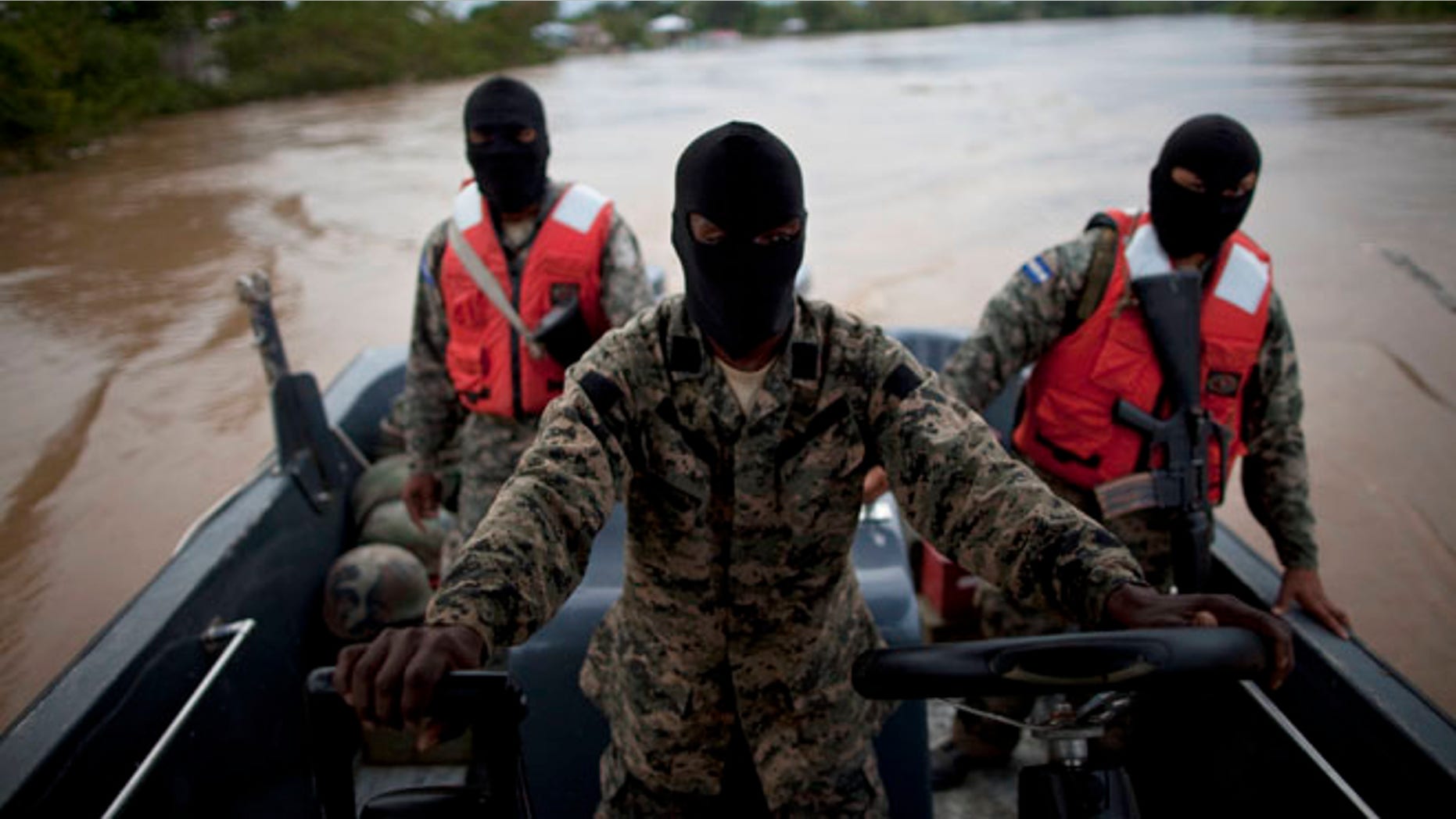Honduran naval personel patrol a river in La Mosquitia, Honduras. May 21, 2012. (Photo AP/Rodrigo Abd)