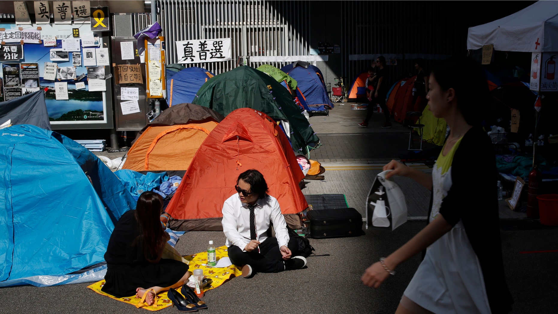 Oct. 29, 2014: Pro-democracy protesters have lunch in the occupied areas outside government headquarters in Hong Kong's Admiralty