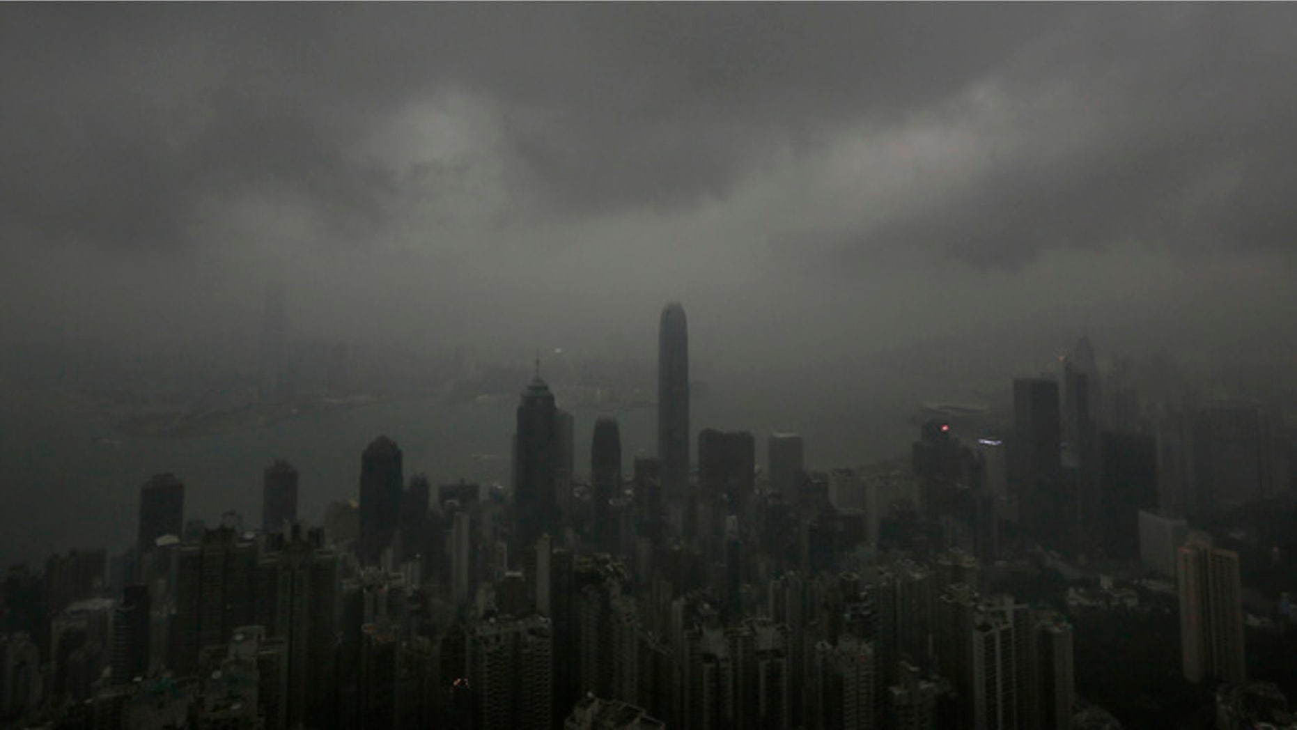 Sept. 22, 2013: Dark clouds hang low over Hong Kong's Victoria Habour. Usagi, the year's most powerful typhoon had Hong Kong in its cross-hair on Sunday after sweeping past the Philippines and Taiwan and pummeling island communities with heavy rains and fierce winds. The typhoon was grinding westward and expected to make landfall close to Hong Kong late Sunday or early Monday.