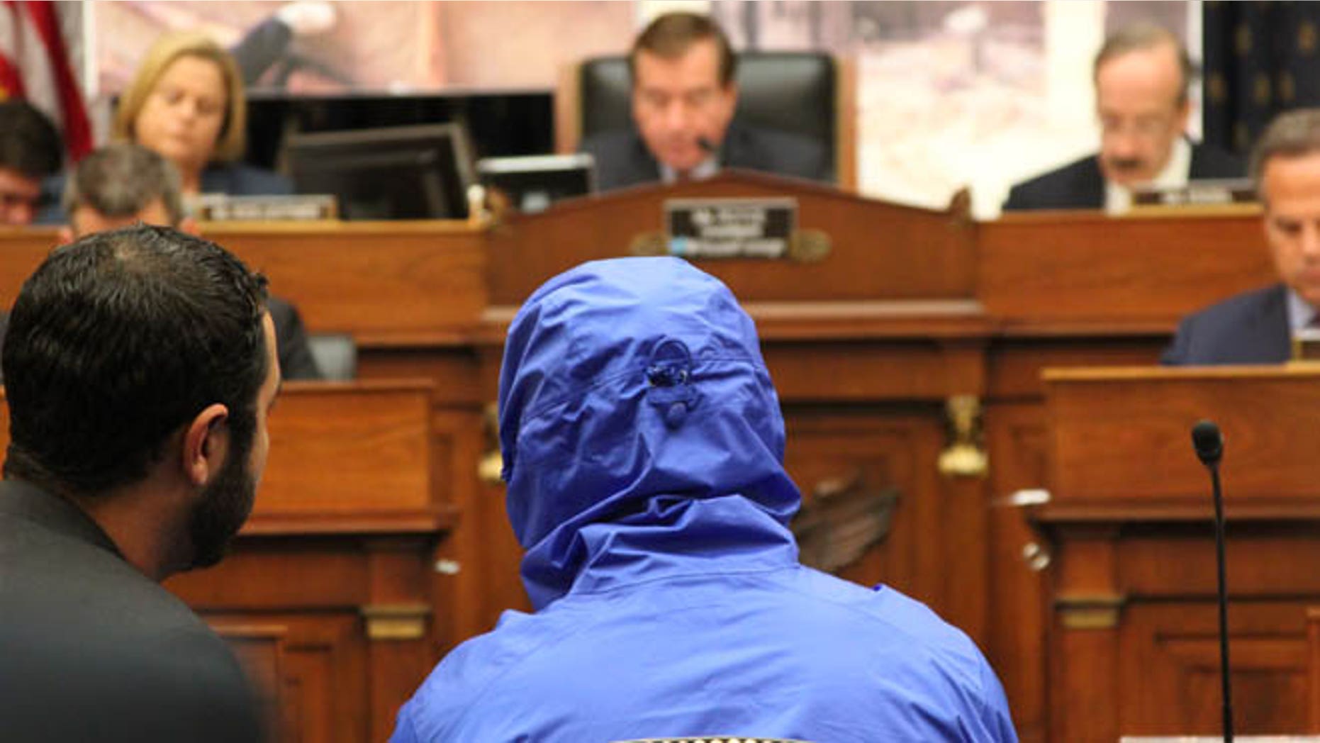 July 31, 2014: A Syrian defector who goes only by the name 'Caesar,' and who wore a hood to obscure his face, testifies before the House Foreign Affairs Committee.