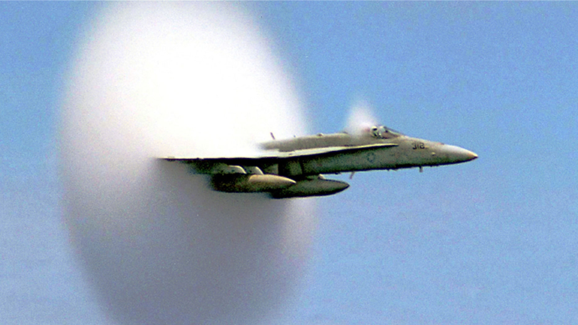 FILE: An F/A-18 Hornet breaks the sound barrier. The sonic booms have been known to shake buildings.