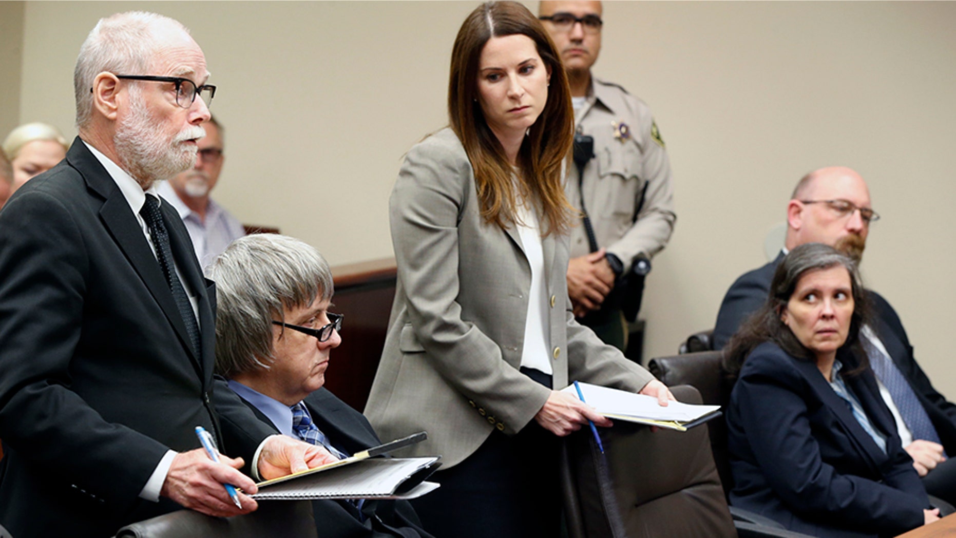 David and Louis Turpin, seen sitting, appeared in court Friday and pleaded not guilty to charges of child abuse