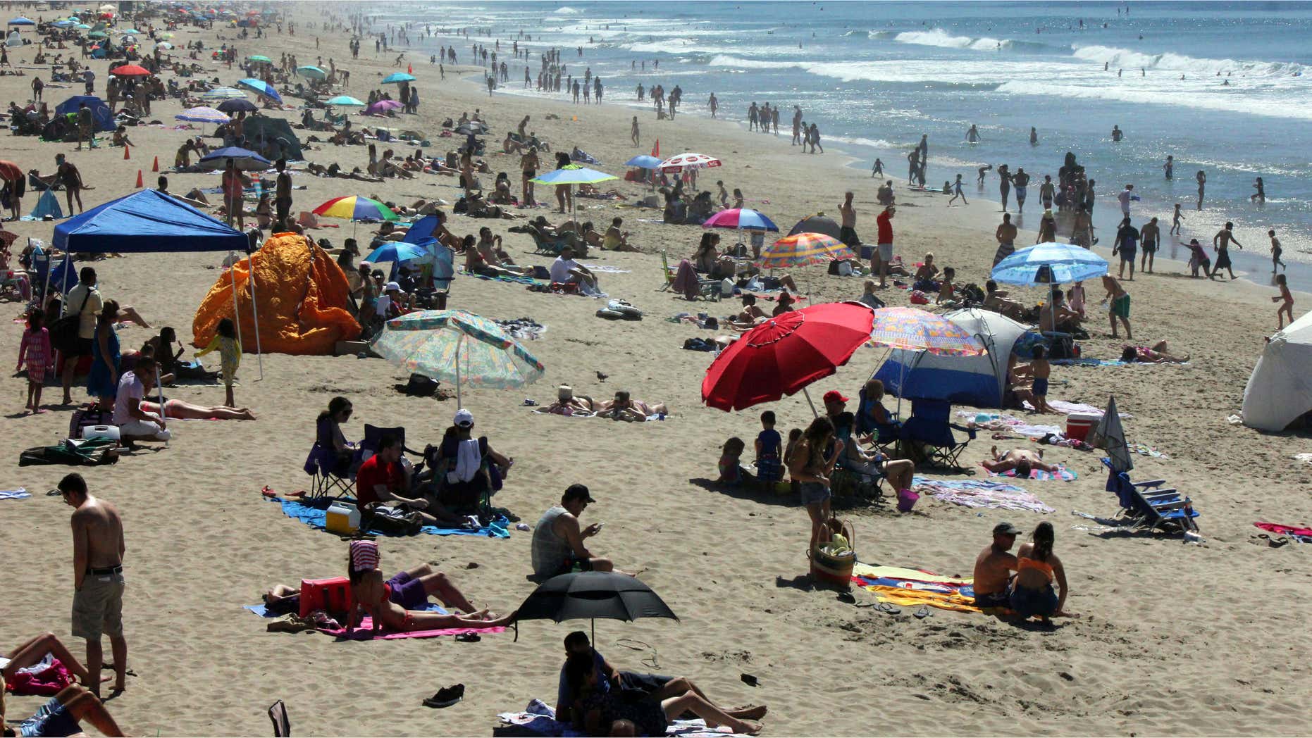 March 14, 2015: Crowds line the shore at Manhattan Beach, Calif., as a late winter heat wave sent temperatures soaring in Southern California.