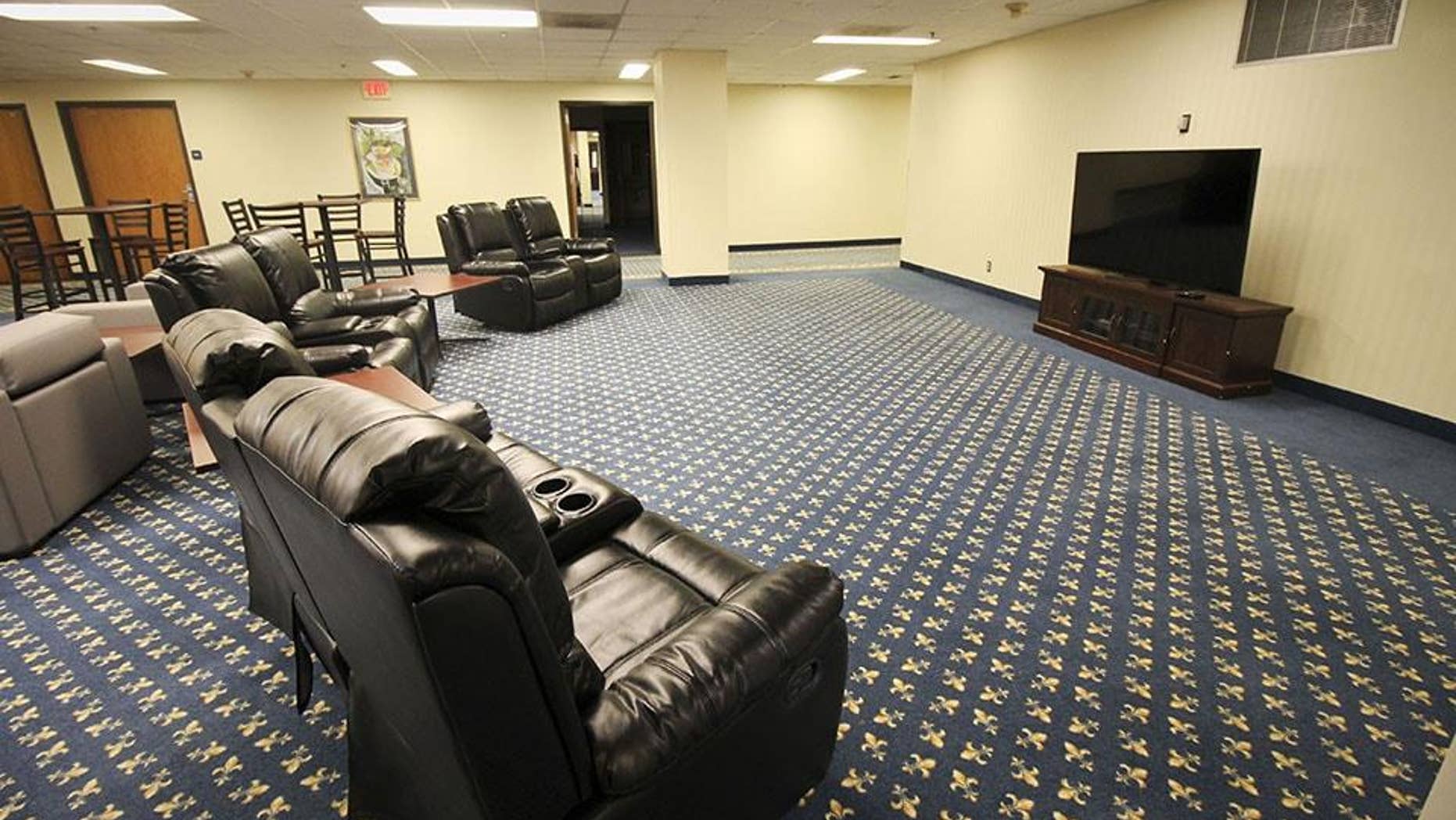 "Hotel Influenza" features private hotel-like rooms with television and internet, as well as common areas where volunteers can socialize.