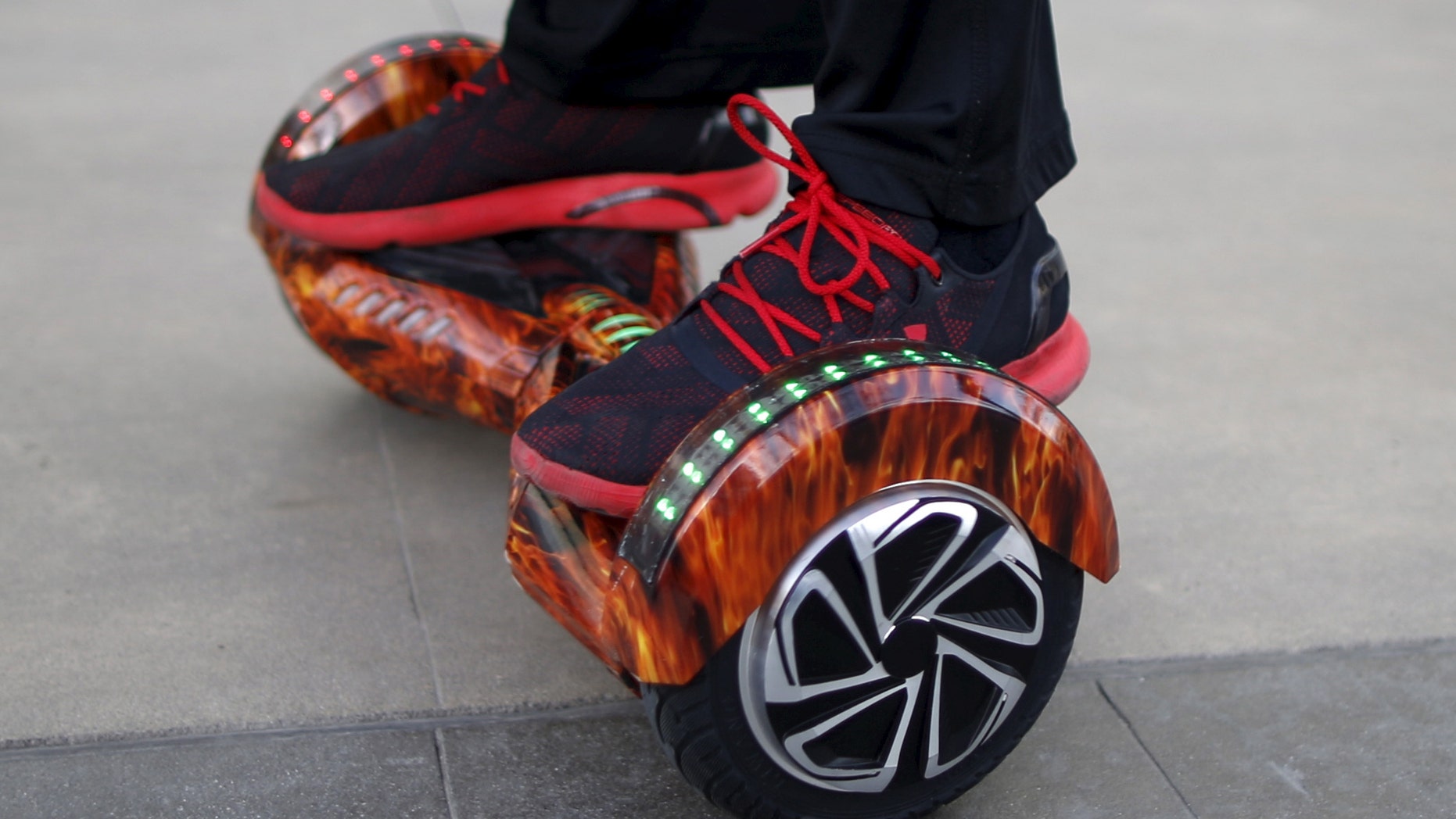 File photo - A boy rides a hoverboard in Santa Monica, Calif., Feb. 23, 2016. (REUTERS/Lucy Nicholson)
