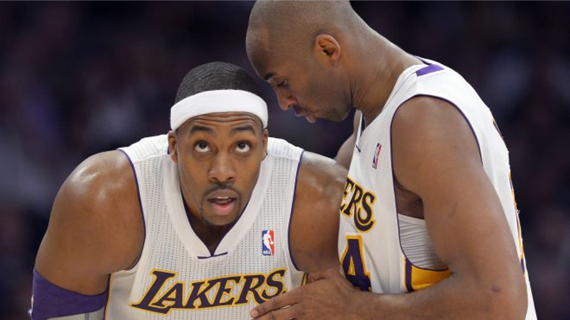Jan. 13, 2013: Los Angeles Lakers guard Kobe Bryant, right, chats with center Dwight Howard during the first half of the Lakers' NBA basketball game against the Cleveland Cavaliers in Los Angeles.