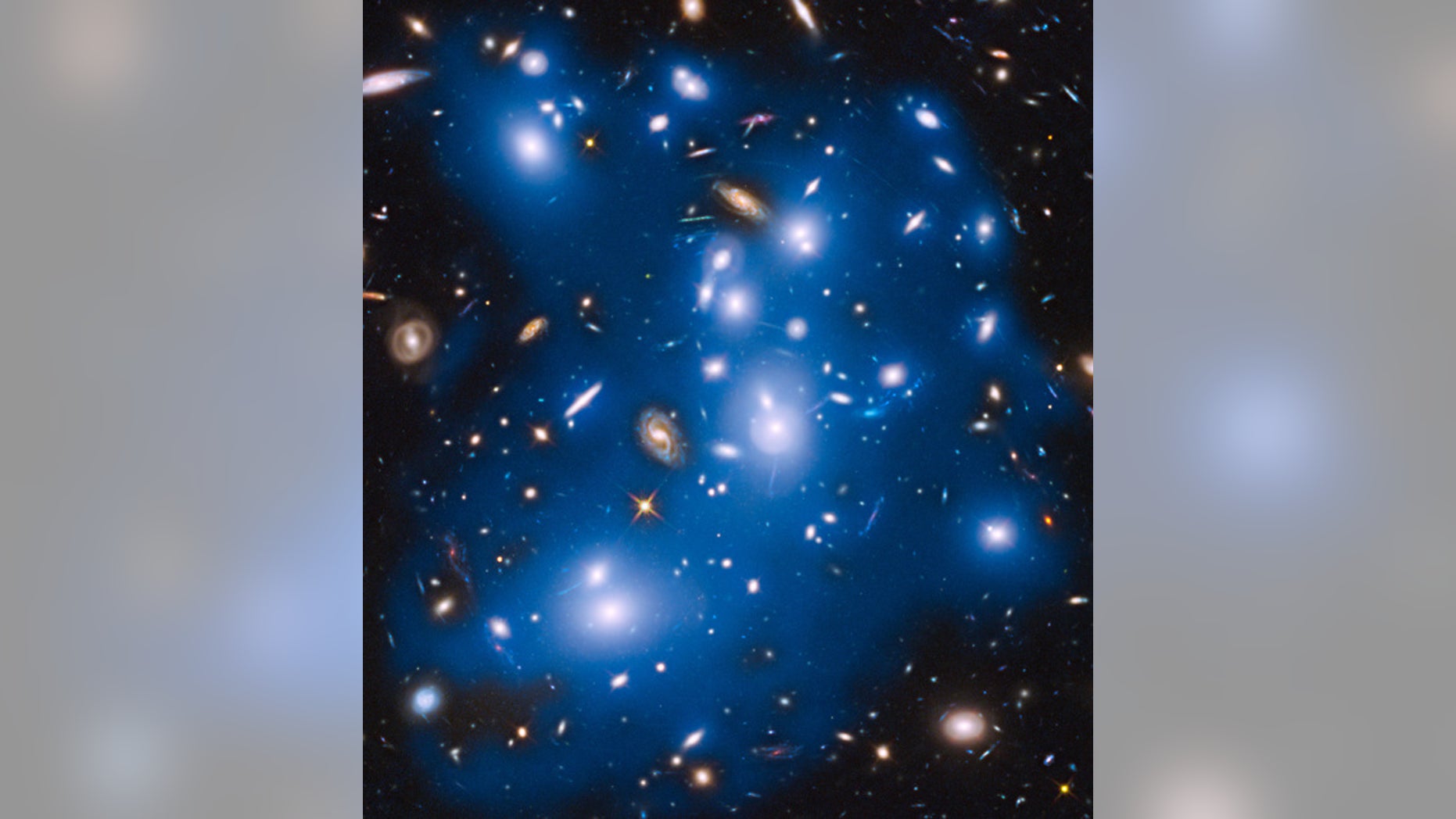 The Hubble Space Telescope captured this image of what scientists described as the "ghost light" of long-dead stars in Pandora's Cluster, a group of galaxies known officially as Abell 2744. This image was released on Oct. 30, 2014.