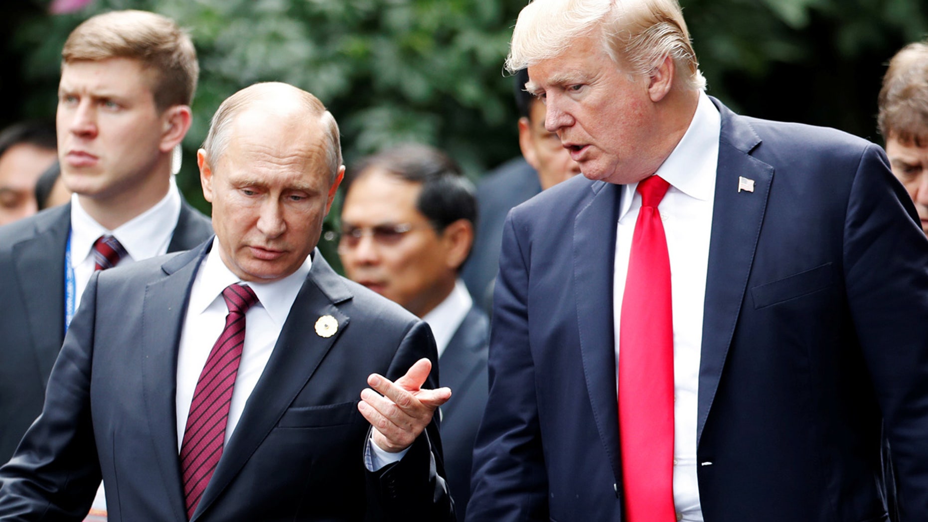 Nov. 11: U.S. President Trump and President Putin talk during the family photo session at the APEC Summit in Danang, Vietnam.