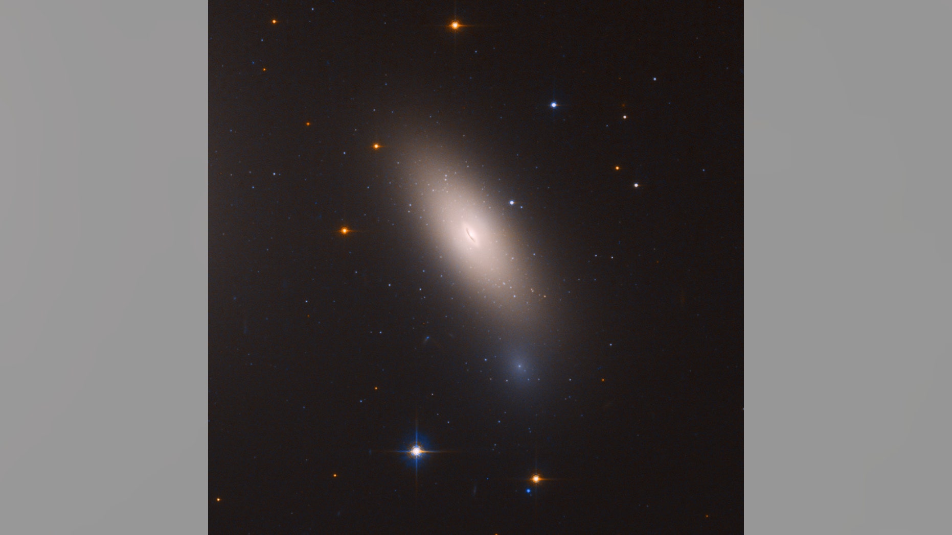 This Hubble Space Telescope image shows the galaxy NGC 1277, which is unique in that it is considered a relic of what galaxies were like in the early universe. NGC 1277 is composed exclusively of aging stars that were born 10 billion years ago.