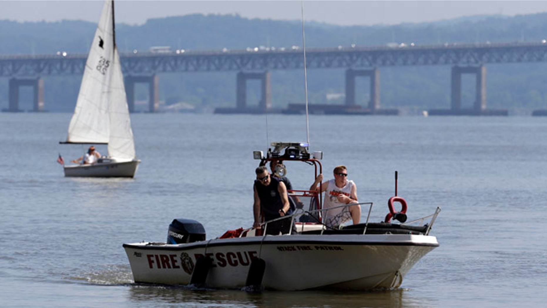 July 27, 2013: Rescue workers on a boat search the Hudson River south of the Tappan Zee Bridge for two people who went missing following a boat crash in Piermont, N.Y. Two people are missing and four others are injured after their boat struck a barge under the bridge, according to the Coast Guard.