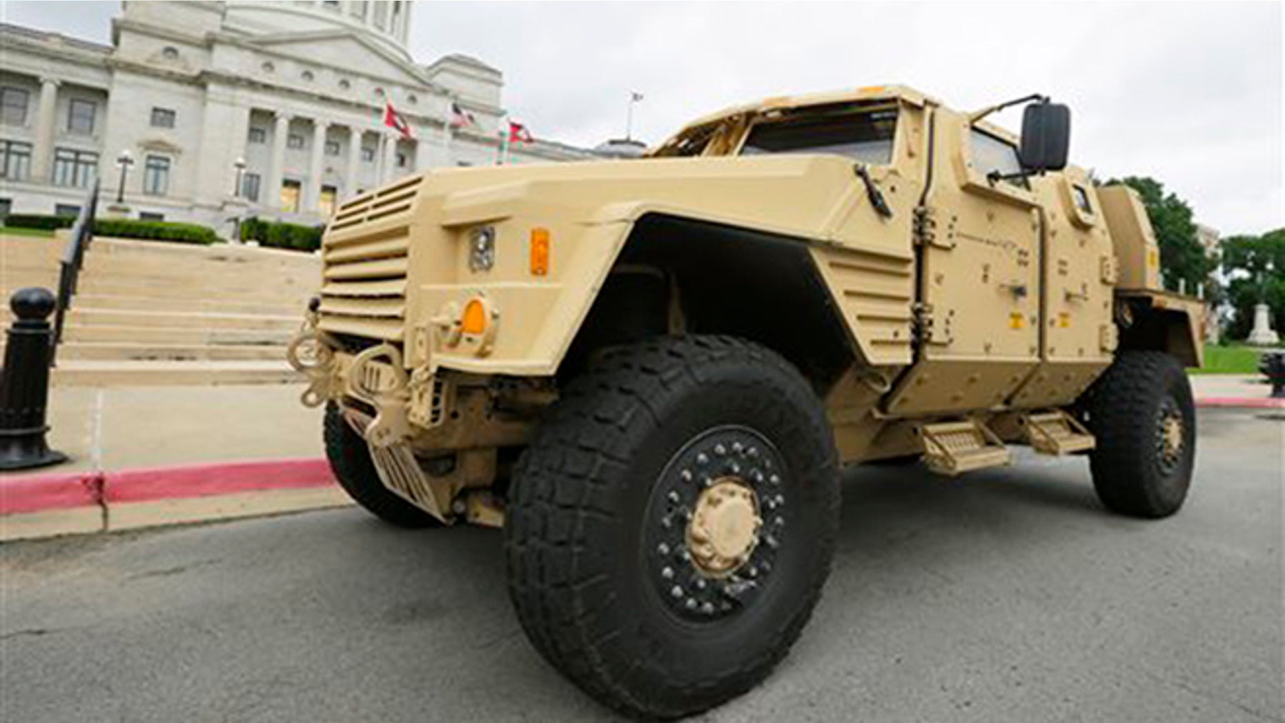 FILE - In this file photo taken May 26, 2015, a prototype of a Lockheed Martin Joint Light Tactical Vehicle is parked in front of the Arkansas state Capitol in Little Rock, Ark. (AP Photo/Danny Johnston, File)