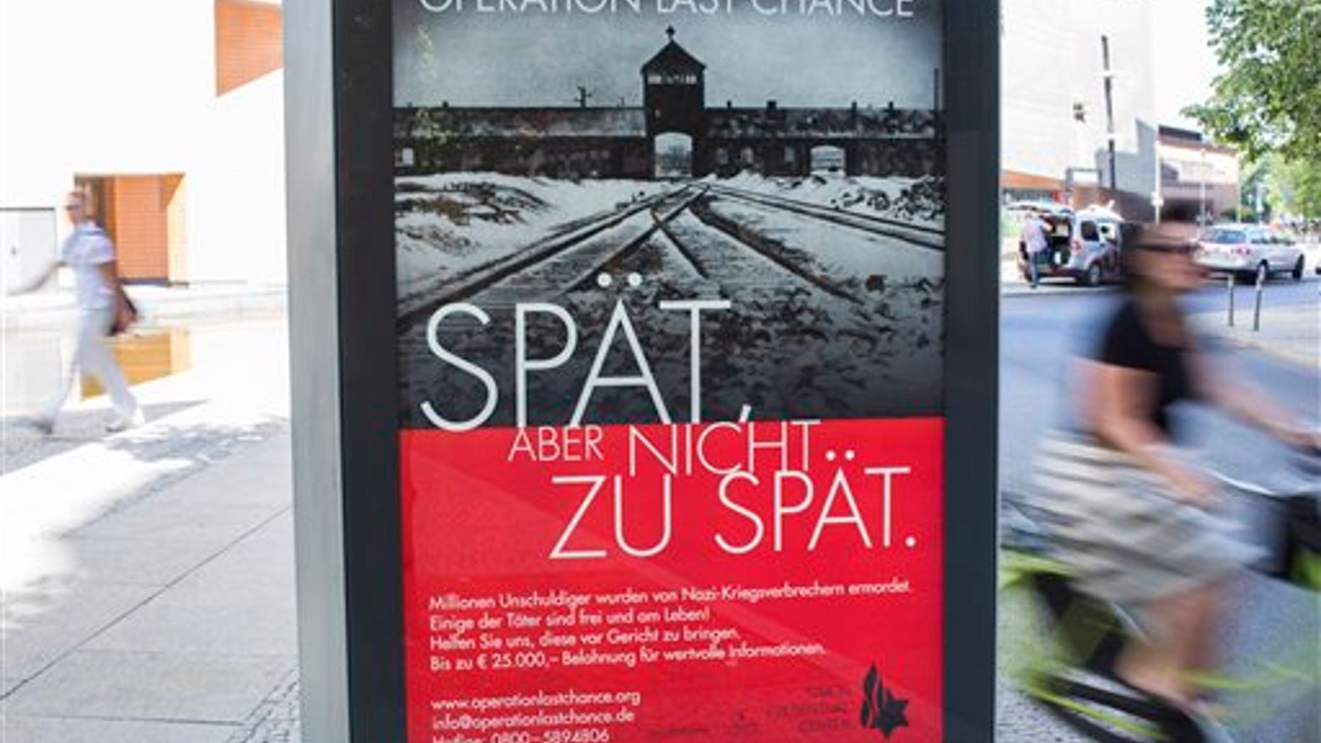 July 23: A placard reading "Operation last chance - late but not too late" is displayed in Berlin, Germany. With 2,000 placards in Berlin, Hamburg and Cologne cities the Simon Wiesenthal Center launched another campaign to find and prosecute Nazi war criminals while they are still alive.