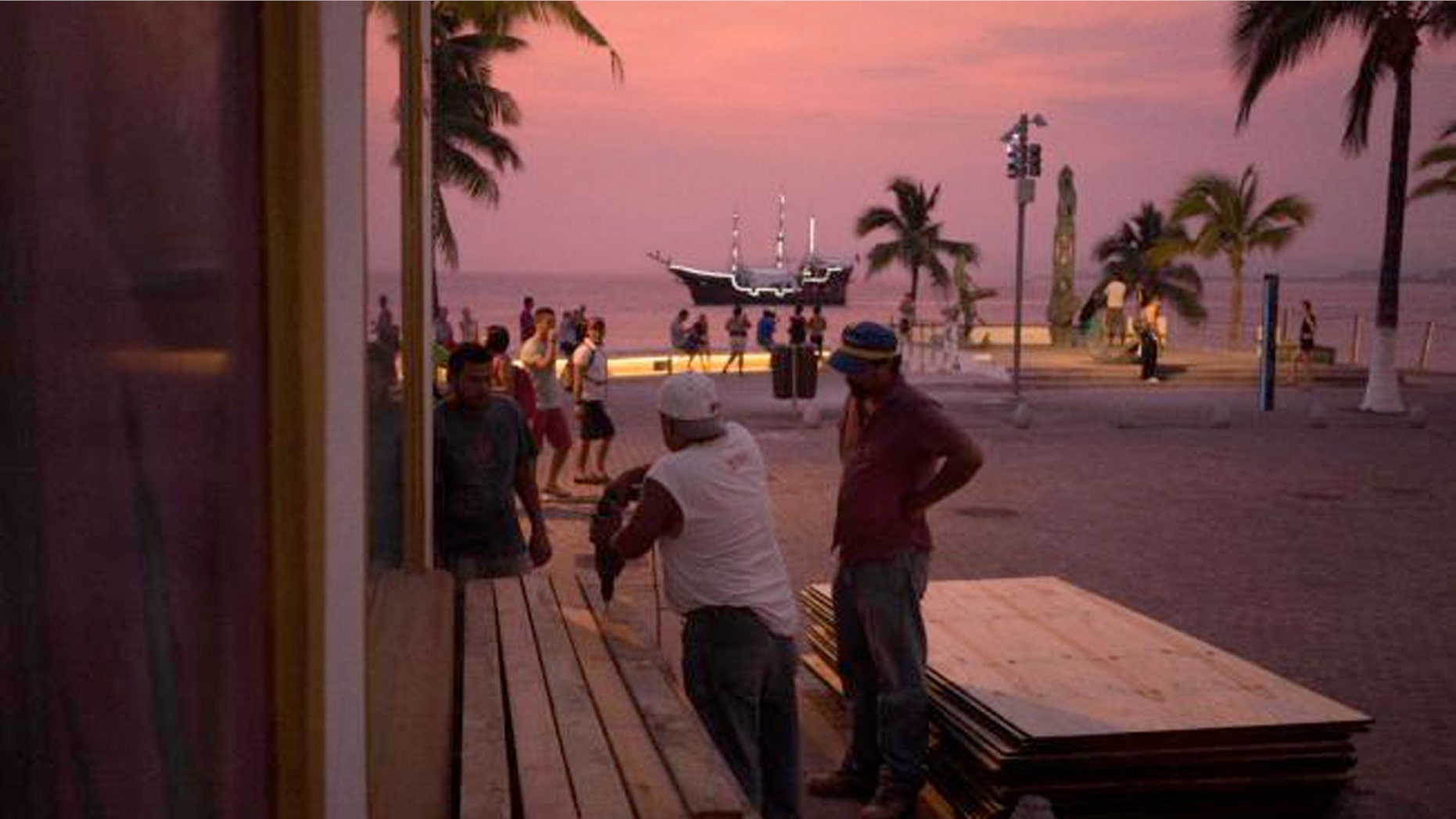 People preparing for the arrival of Hurricane Patricia board up the windows of a seaside business in the Pacific resort city of Puerto Vallarta, Mexico.