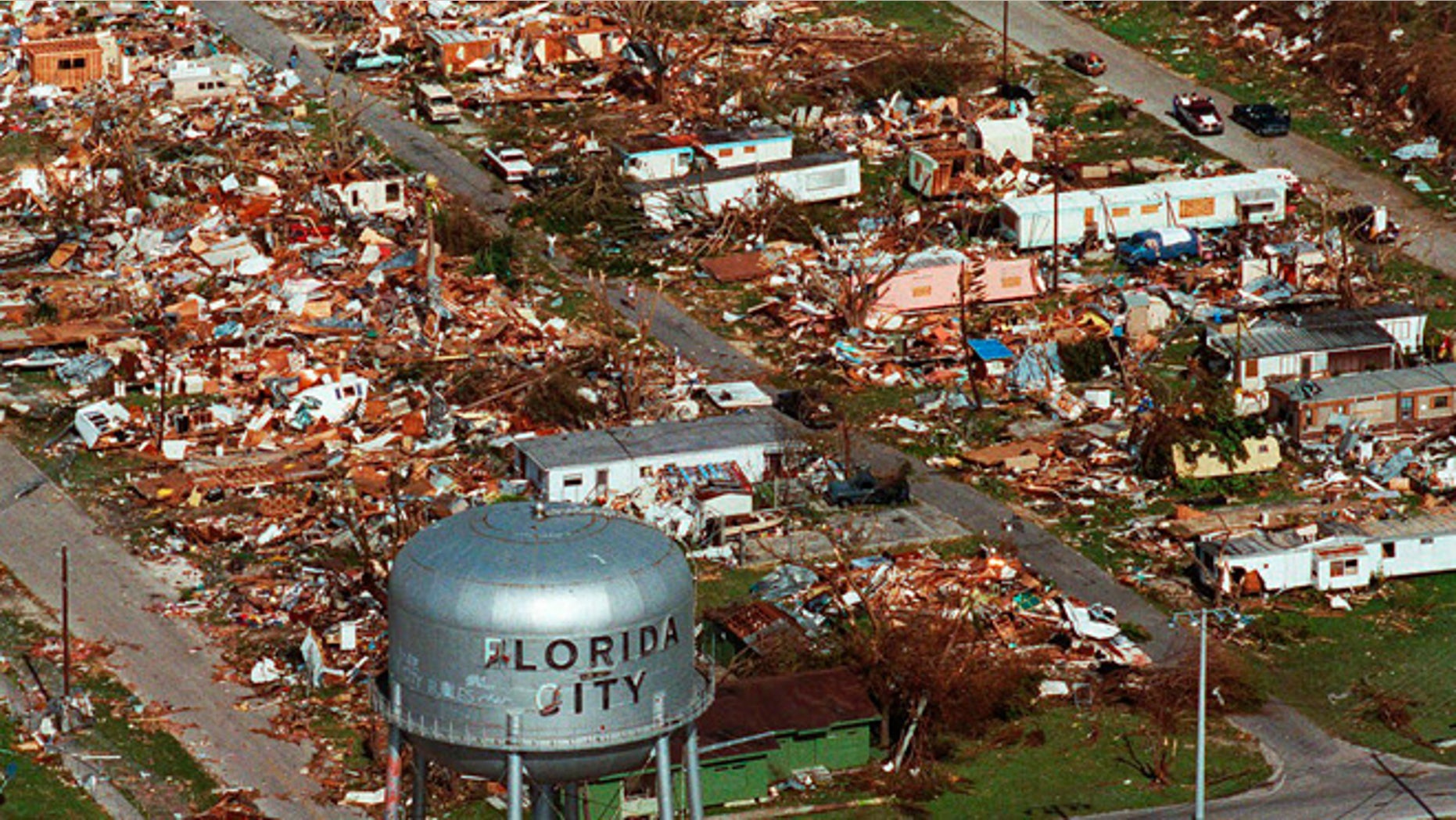 This Aug. 25, 1992 file photo shows the water tower, a landmark in Florida City, Fla. still standing over the ruins of the Florida coastal community that was hit by the force of Hurricane Andrew. Cities like Tampa, Houston, Jacksonville and Daytona Beach historically get hit with major hurricanes every 20 to 40 years, according to meteorologists. But those same places have now gone at least 70 years, sometimes more than a century, without getting smacked by those monster storms, according to data analyses by an MIT hurricane professor and The Associated Press.