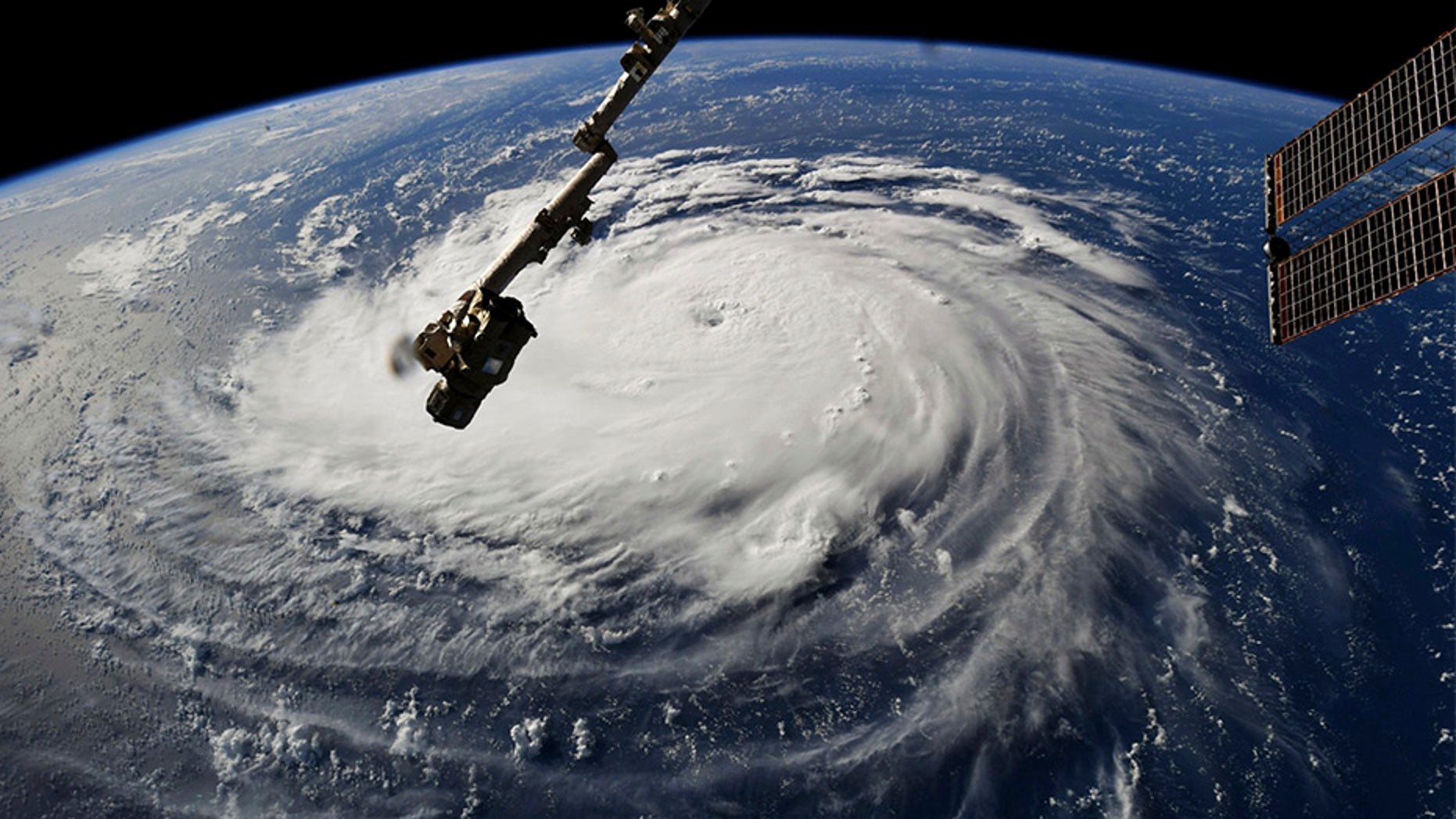 This photo provided by NASA shows Hurricane Florence from the International Space Station on Monday, Sept. 10, 2018, as it threatens the U.S. East Coast. Forecasters said Florence could become an extremely dangerous major hurricane sometime Monday and remain that way for days. (NASA via AP)