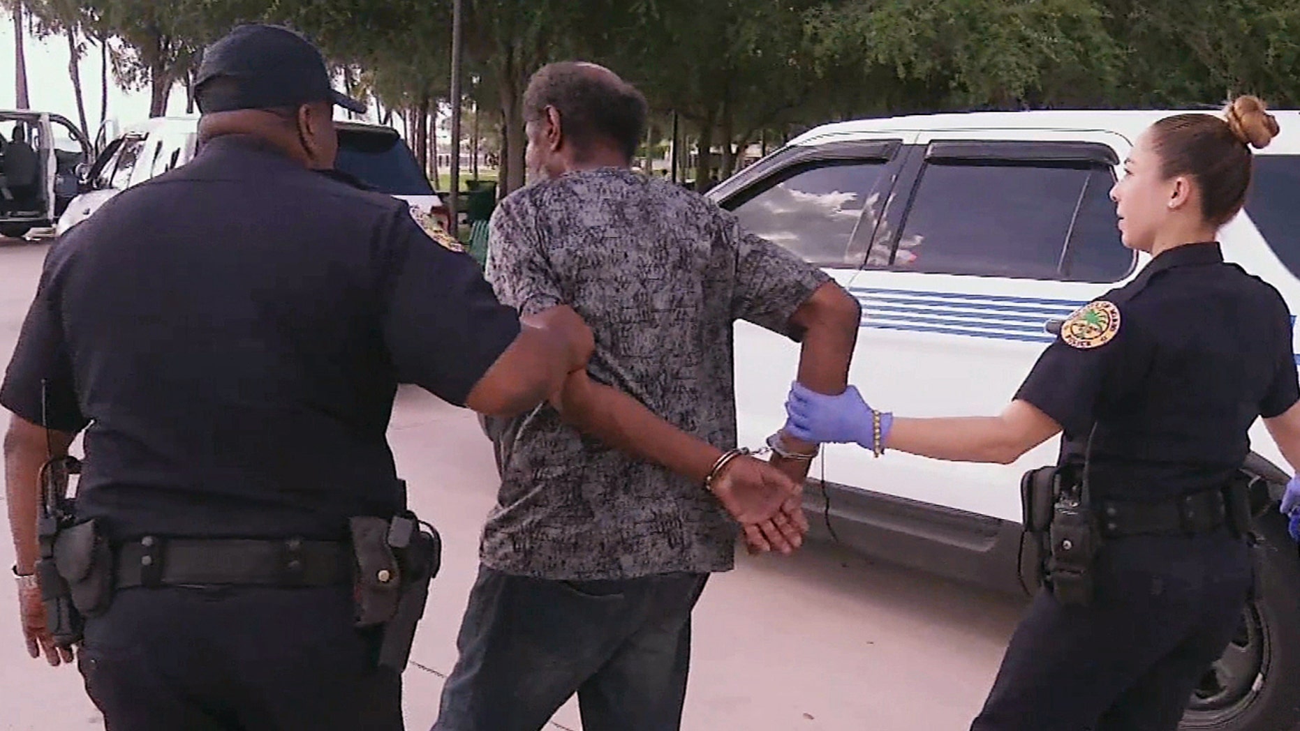 In this video clip from Sept. 8, 2017, officials in Miami detain a person who is homeless ahead of powerful Hurricane Irma.