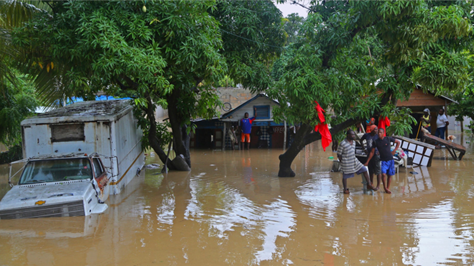 Oct. 26, 2012: Residents of Leogane, Haiti find higher ground as the water level continues to rise. Residents of Leogane have had five consecutive days of rain in the aftermath of Hurricane Sandy, which caused serious flooding and claimed at least 26 lives in the impoverished country.