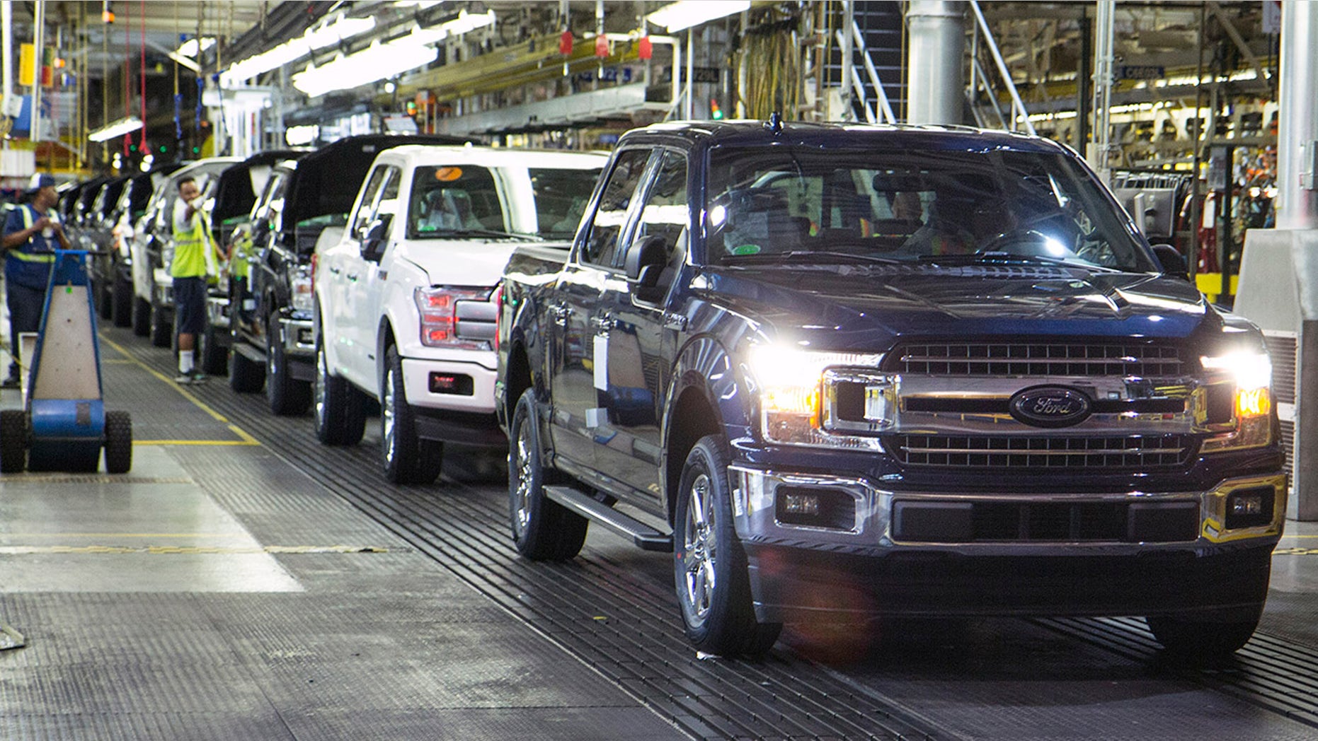 The first ford f 150 truck rolls off the line this morning at dearborn truck
