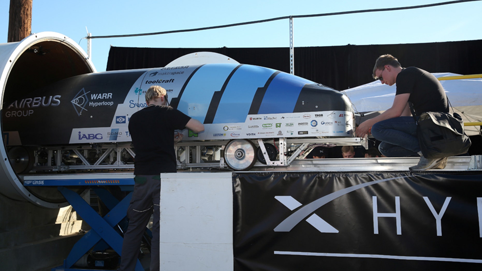 File photo - Team members from WARR Hyderloop, Technical University of Munich place their pod on the track during the SpaceX Hyperloop Pod Competition in Hawthorne, Los Angeles, California, U.S., Jan. 29, 2017. (REUTERS/Monica Almeida)