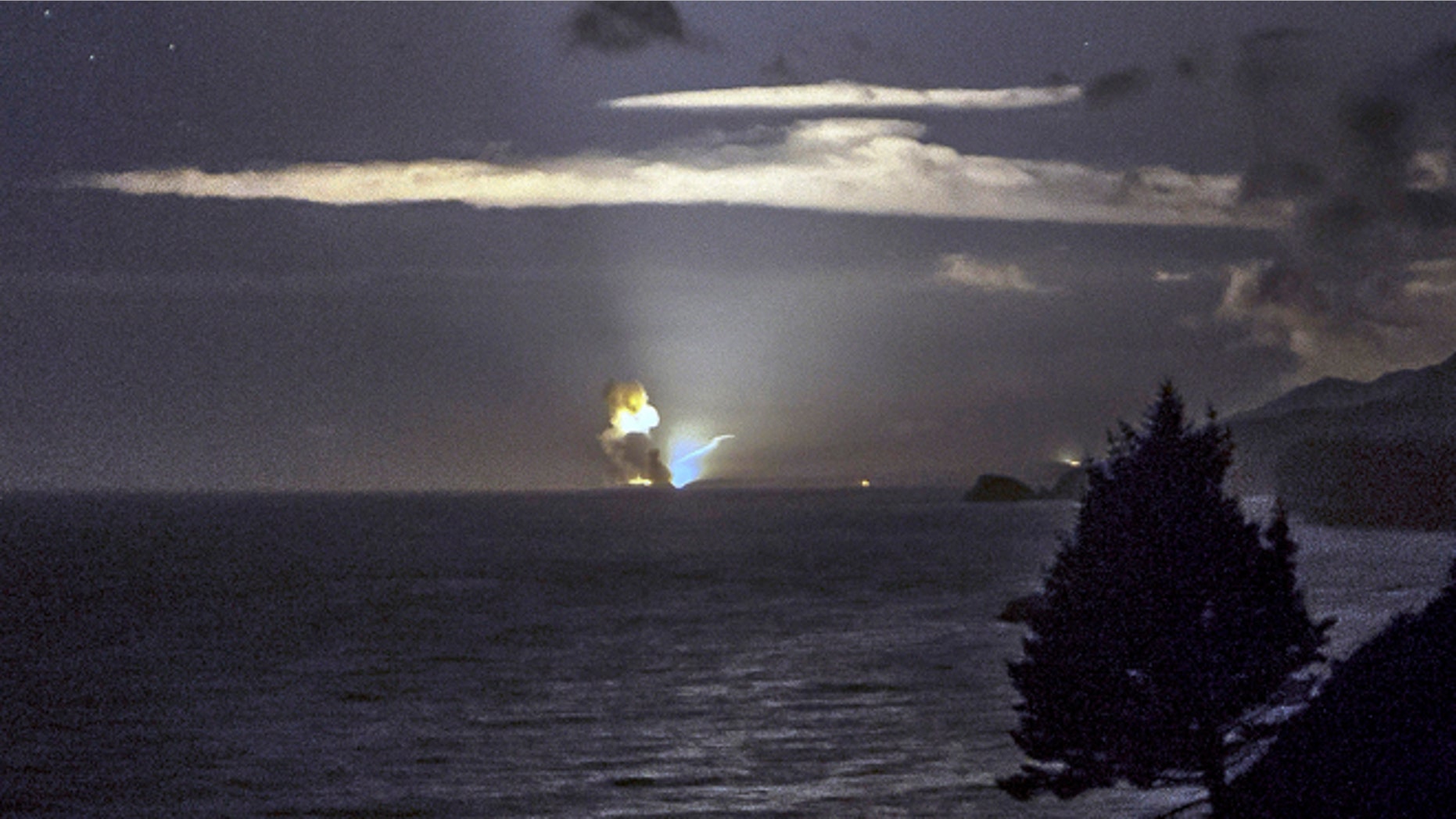 Aug. 25: A photo provided by Scott Wight shows the horizon from Cape Greville in Chiniak, Alaska, after a rocket carrying an experimental Army strike weapon exploded after taking off from a launch pad in Alaska.