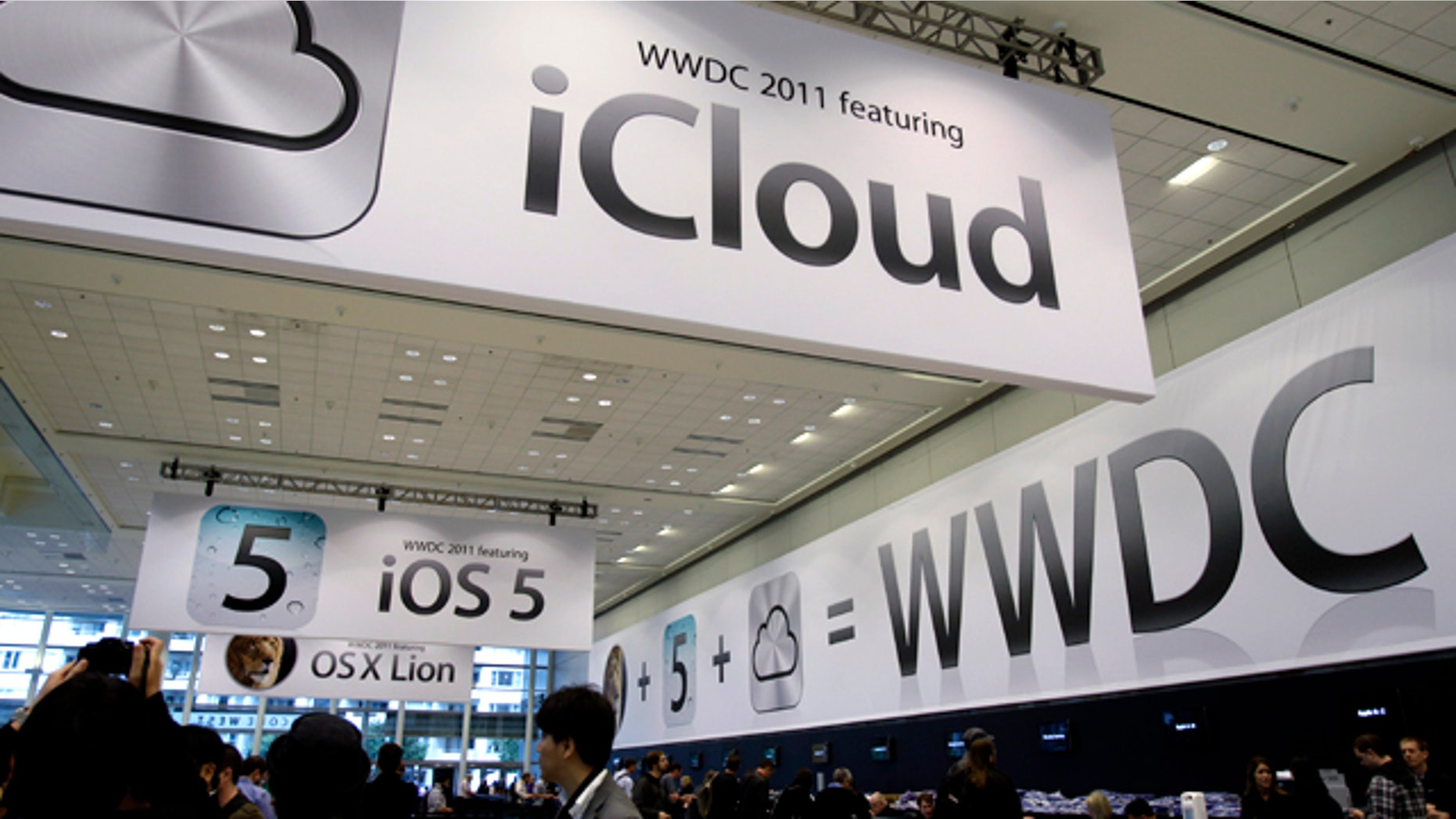 June 6, 2011: Posters on display at the Apple Worldwide Developers Conference in San Francisco tout the new iCloud service. Apple CEO Steve Jobs is scheduled to take a break from medical leave Monday to announce iCloud.