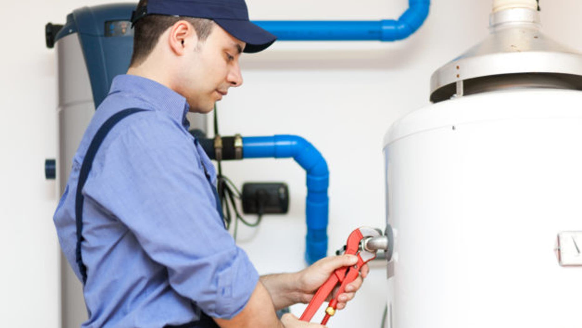 Technician repairing an hot-water heater