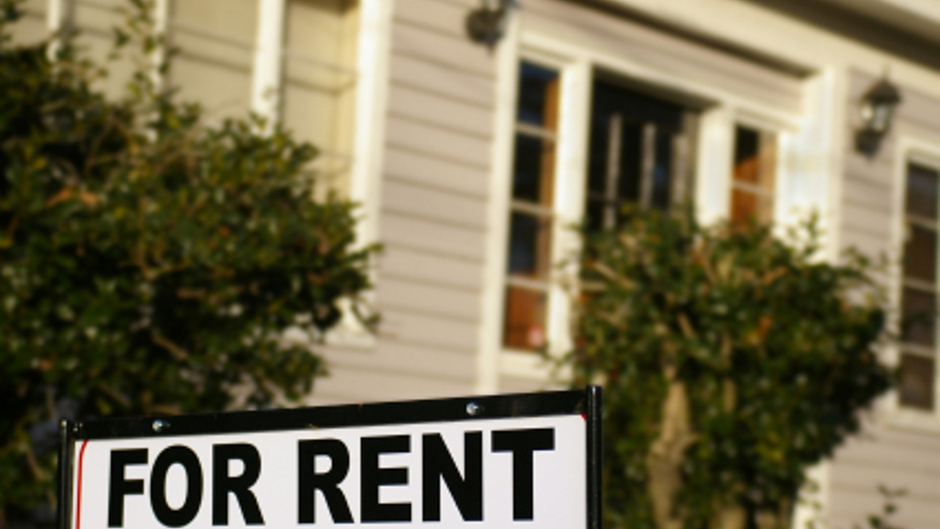 House with "For Rent" sign