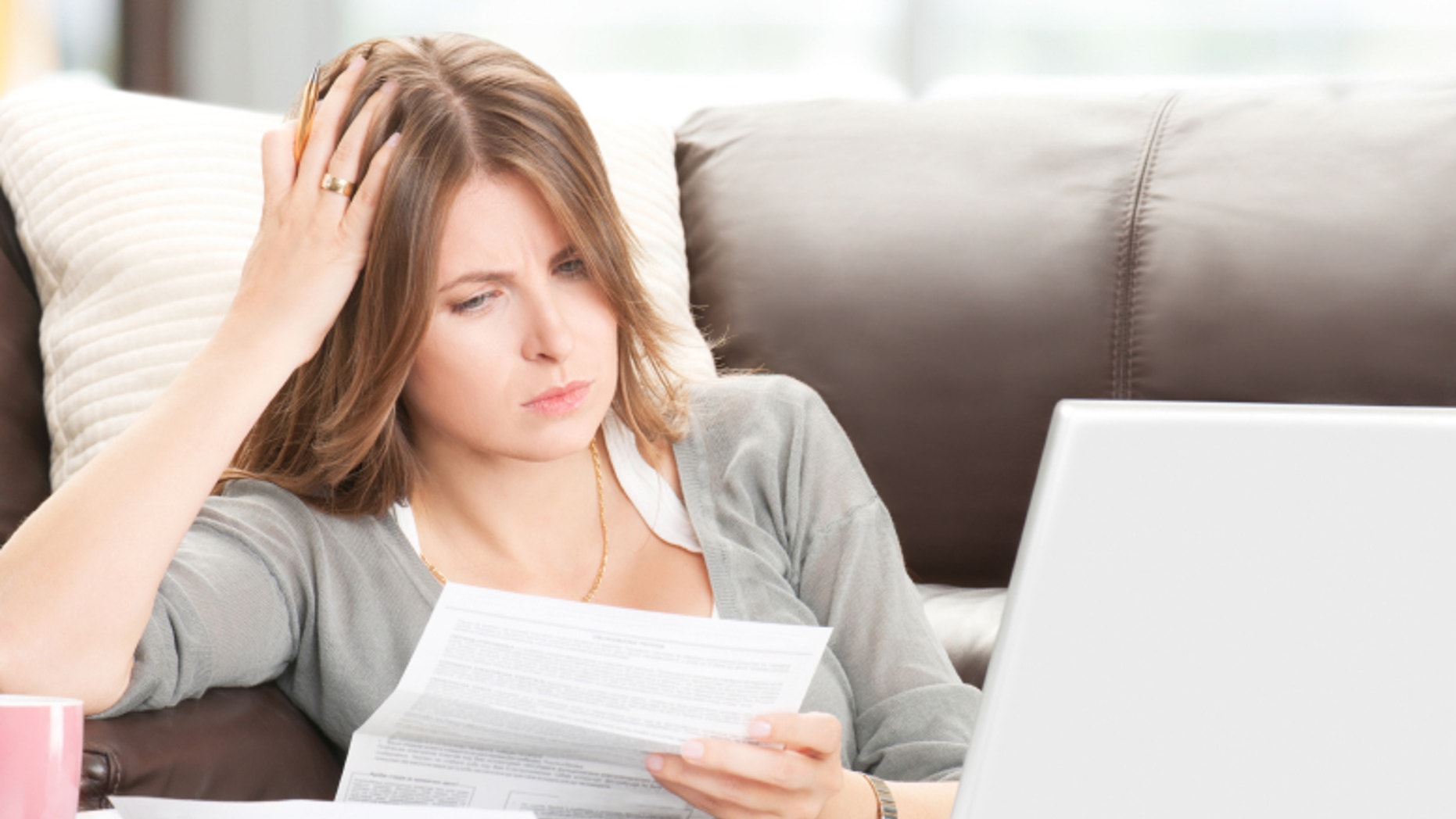 Doing financial paperwork, as in taxes