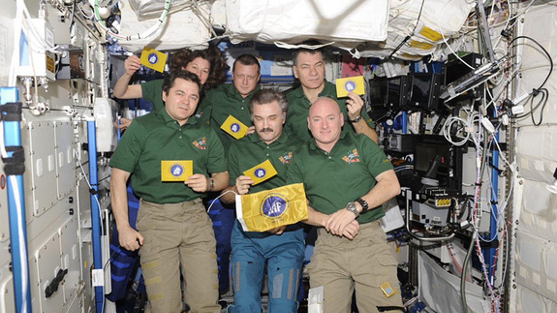 International Astronautical Federation (IAF) flags seen aboard the International Space Station during their first spaceflight with the Soyuz TMA-20 and Expedition 26 crews.