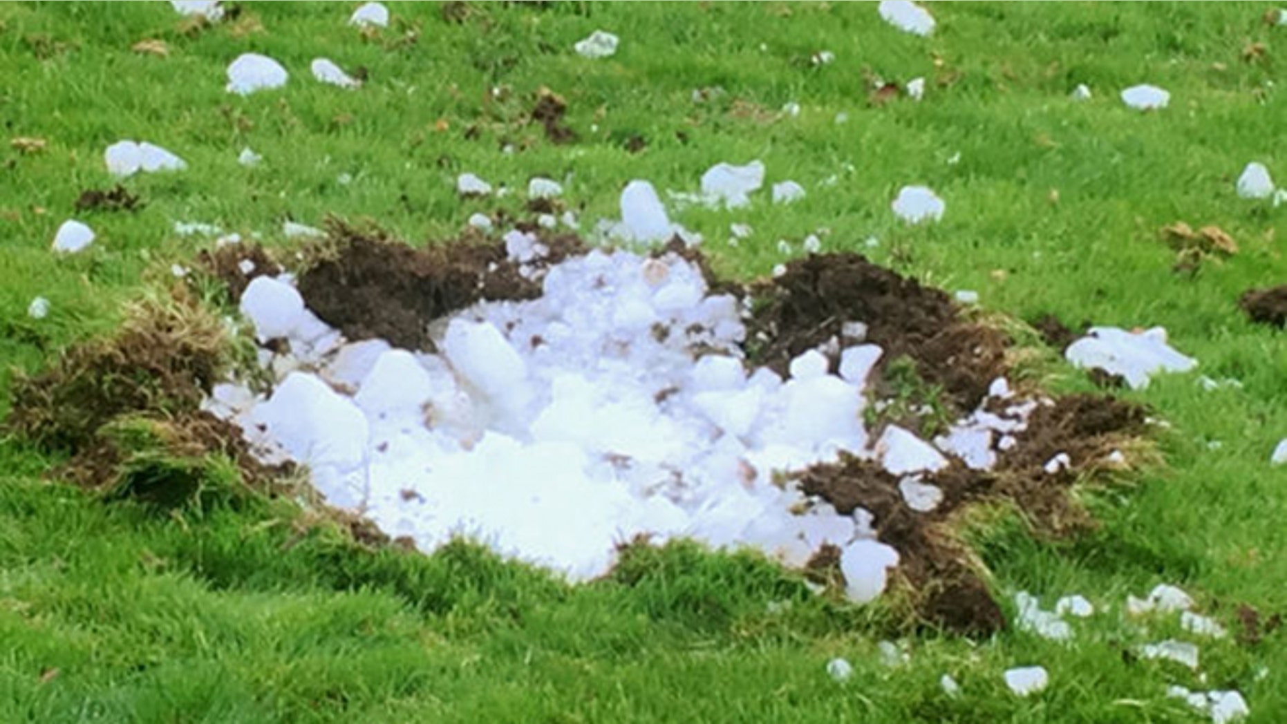 A Scottish family claims this block of ice fell out of the sky and landed in their garden.