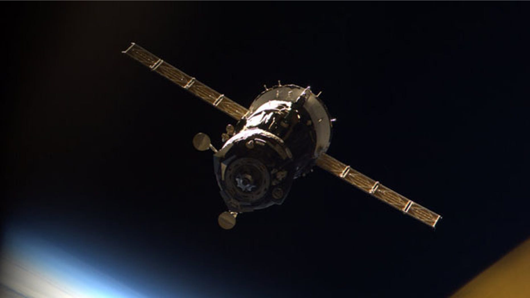 The Russian Soyuz TMA-16 spacecraft carrying astronaut Jeff Williams and cosmonaut Maxim Suraev is seen undocking from the International Space Station on March 18, 2010 in this photo taken from inside the station by Japanese astronaut Soichi Noguchi.