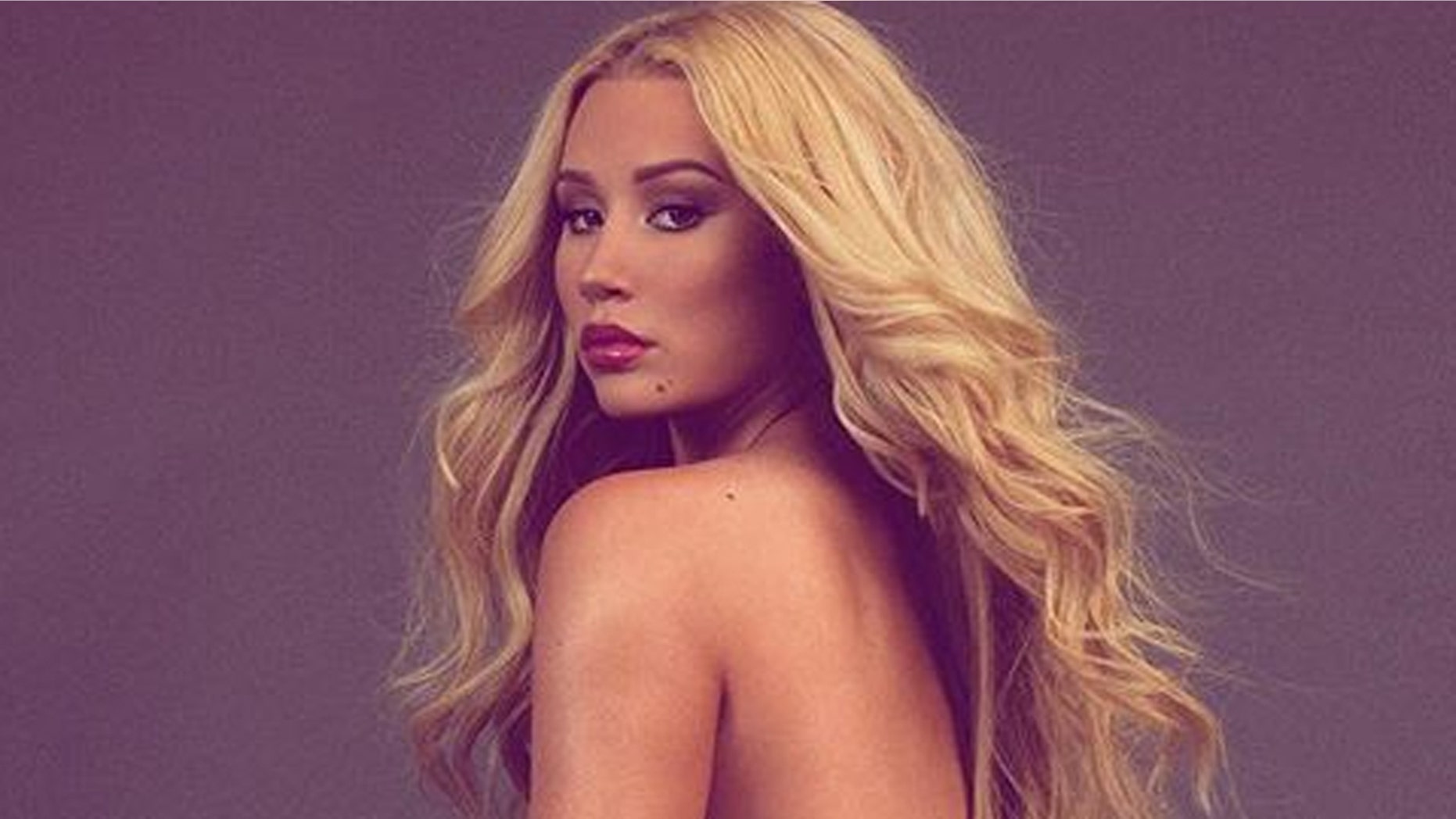 Iggy Azalea defends her racy Instagram photos and claps back at haters who have criticized her for sharing the snaps.