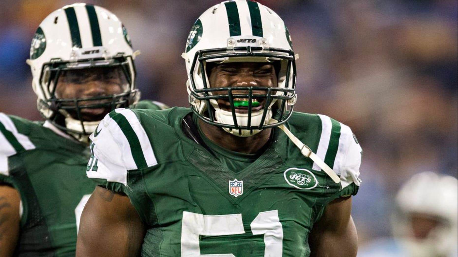 NASHVILLE, TN - DECEMBER 14: Ikemefuna Enemkpali #51 of the New York Jets celebrates in the fourth quarter after sacking the quarterback during a game against the Tennessee Titans at LP Field on December 14, 2014 in Nashville, Tennessee. The Jets defeated the Titans 16-11. (Photo by Wesley Hitt/Getty Images)