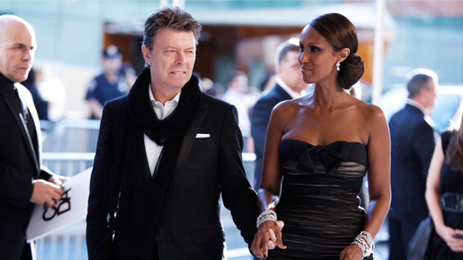 June 7, 2010. Singer David Bowie arrives with his wife Iman to attend the Council of Fashion Designers of America (CFDA) fashion awards in New York.