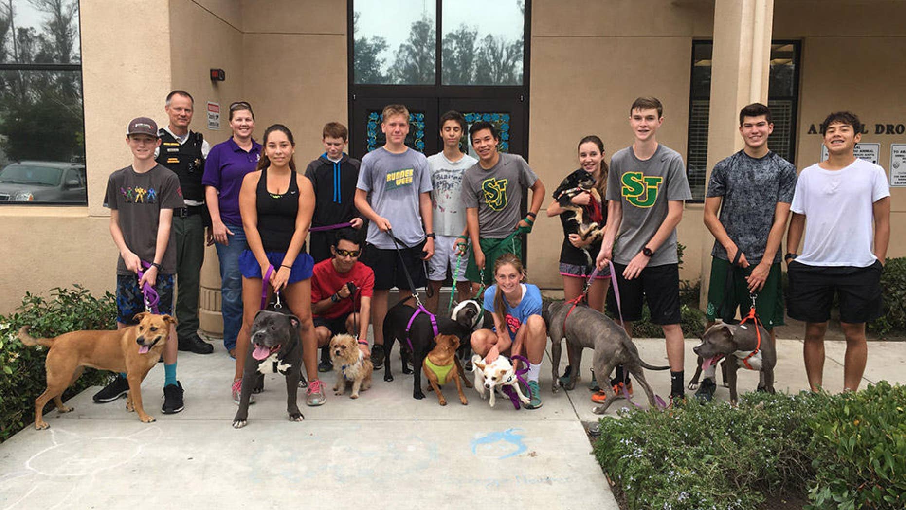 Runners on the St. Joseph High School cross-country team pose with their new training partners (photograph courtesy of Luis Escobar)