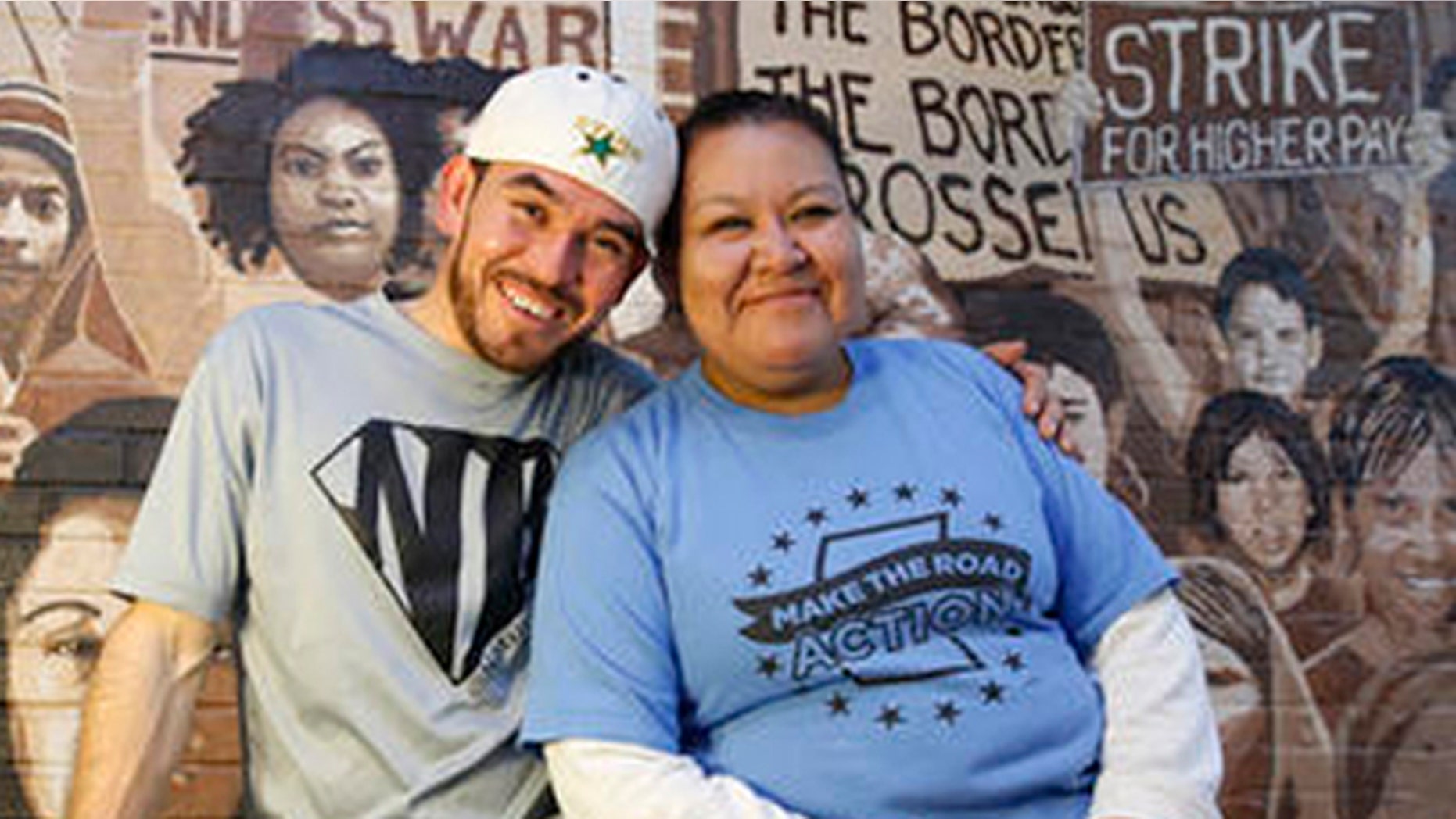 In this Wednesday, Oct. 26, 2016 photo, Guatemalan immigrant and construction worker Mauricio Pelaez-Alvarez, 33, left, poses for a photograph with immigrant rights activist Juana Alvarez, 39, (no relation) after each shared their thoughts with The Associated Press about the upcoming presidential election at Make the Road New York's Brooklyn offices in New York. Although Alvarez has lived in the United States since she emigrated at age 16, and Pelaez-Alvarez has been in the U.S. for ten years, neither can vote in the November election. (AP Photo/Kathy Willens)