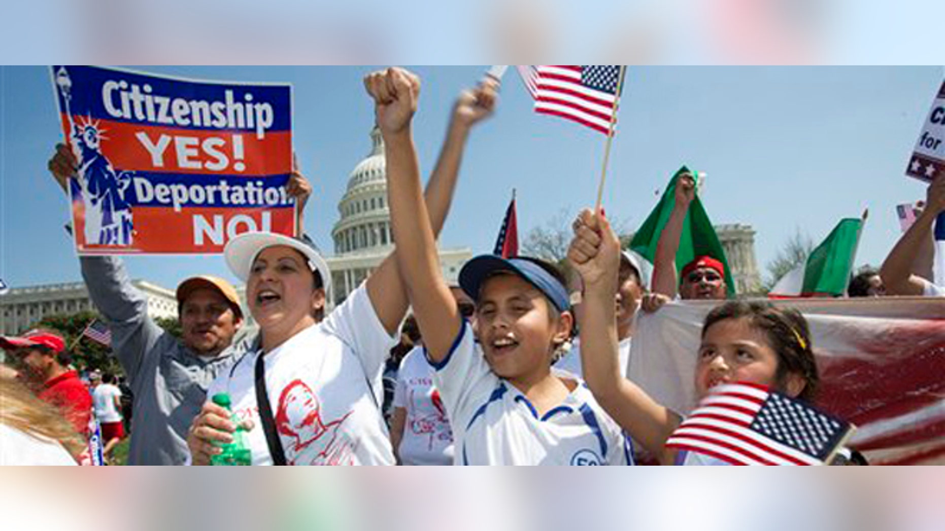 Adita Chicas, left, and her son Jessy Chicas, 10, of Woodbridge, Va., cheer as they arrive at the "Rally for Citizenship" on Capitol, Hill in Washington, Wednesday, April 10, 2013, where tens of thousands of immigrants and their supporters are expected to rally for immigration reform. Bipartisan groups in the House and Senate are said to be completing immigration bills that include a pathway to citizenship for the nation's 11 million immigrants with illegal status. (AP Photo/Jacquelyn Martin)