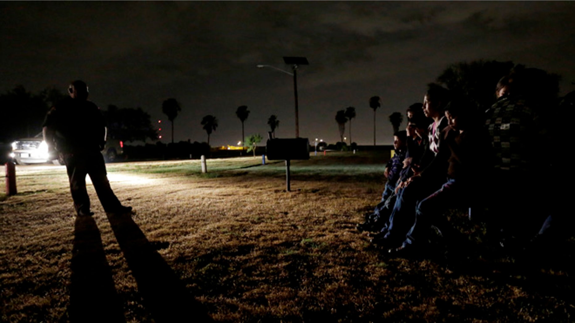 June 25, 2014: A group of immigrants from Honduras and El Salvador, who crossed the U.S.-Mexico border illegally, are stopped in Granjeno, Texas.