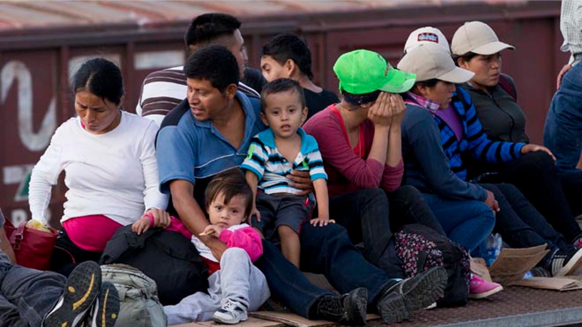 Central Americans ride a freight train toward the U.S.-Mexico border, on July 12, 2014.