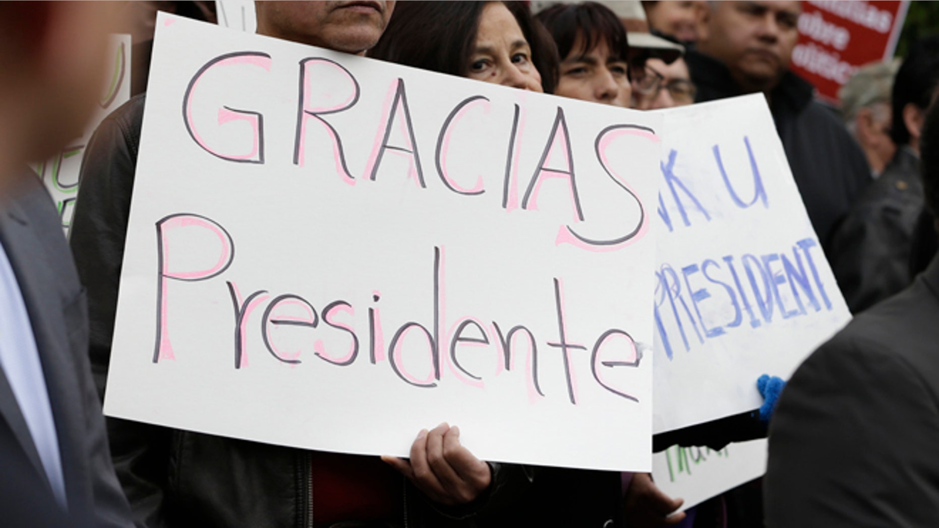 This Friday, Nov. 21, 2014 file photo shows activists and supporters celebrate President Barack Obama's executive action on immigration in Sacramento, Calif.