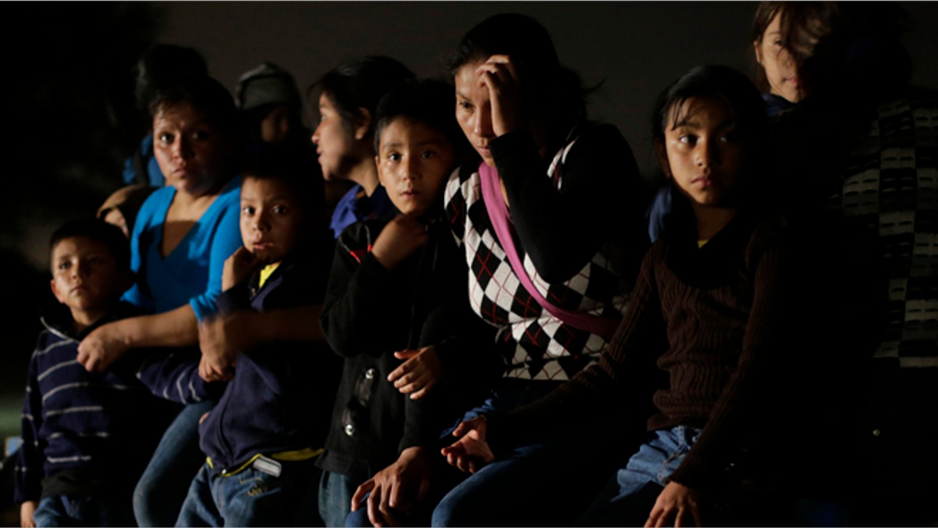 June 25, 2014: A group of immigrants from Honduras and El Salvador who crossed the U.S.-Mexico border illegally are stopped in Granjeno, Texas. Jim Gilchrist, founder and president of the Minuteman Project, said the current immigration flood in the state highlighted the need for a return. (AP/Eric Gay, File)
