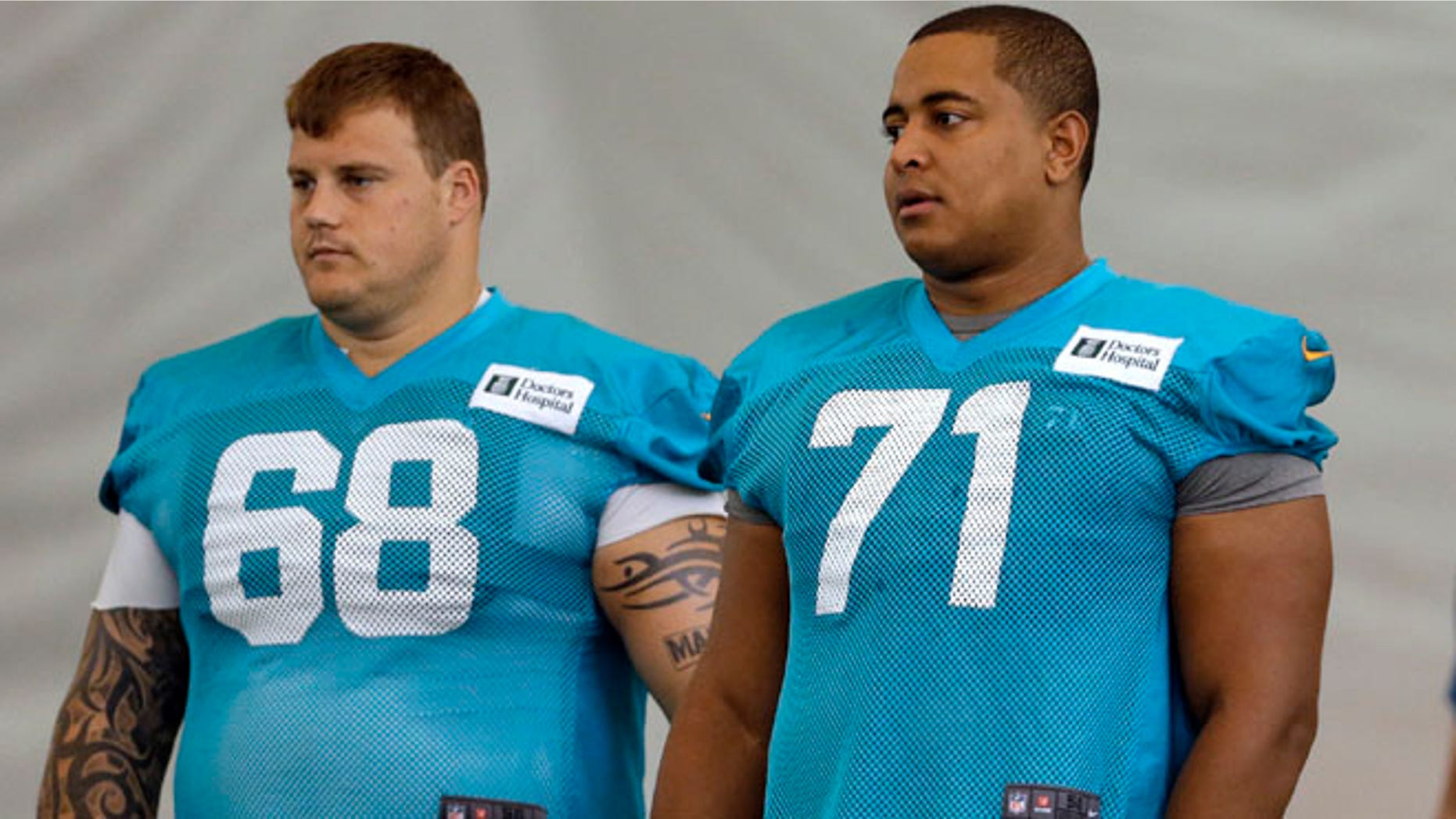 July 24, 2013: In this file photo, Miami Dolphins guard Richie Incognito (68) and tackle Jonathan Martin (71) stand on the field during NFL football practice in Davie, Fla.