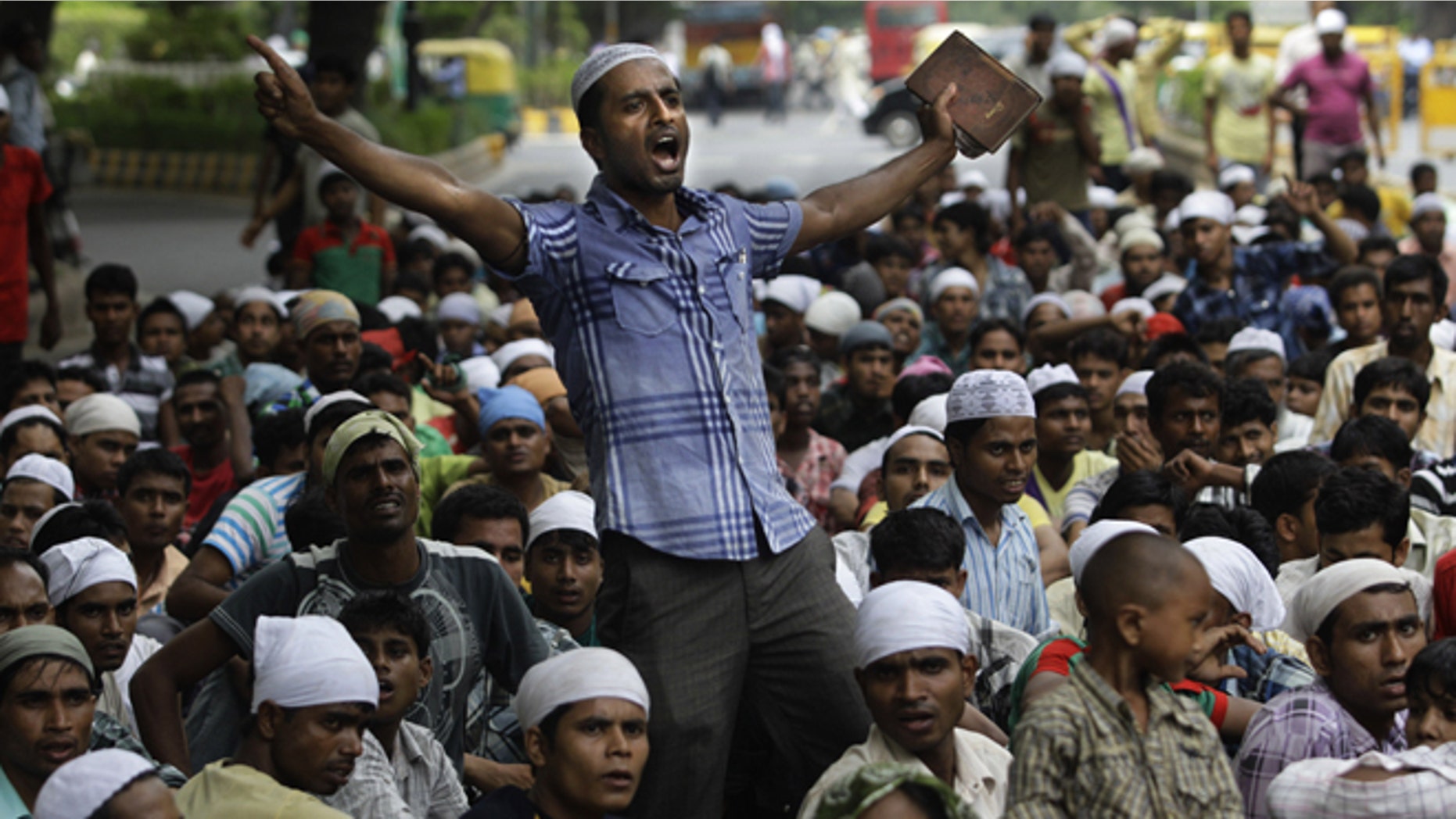 July 25, 2012: Muslims hailing from India's north eastern Assam state and living in New Delhi shout slogans during a protest against the ethnic violence in Assam in New Delhi, India.