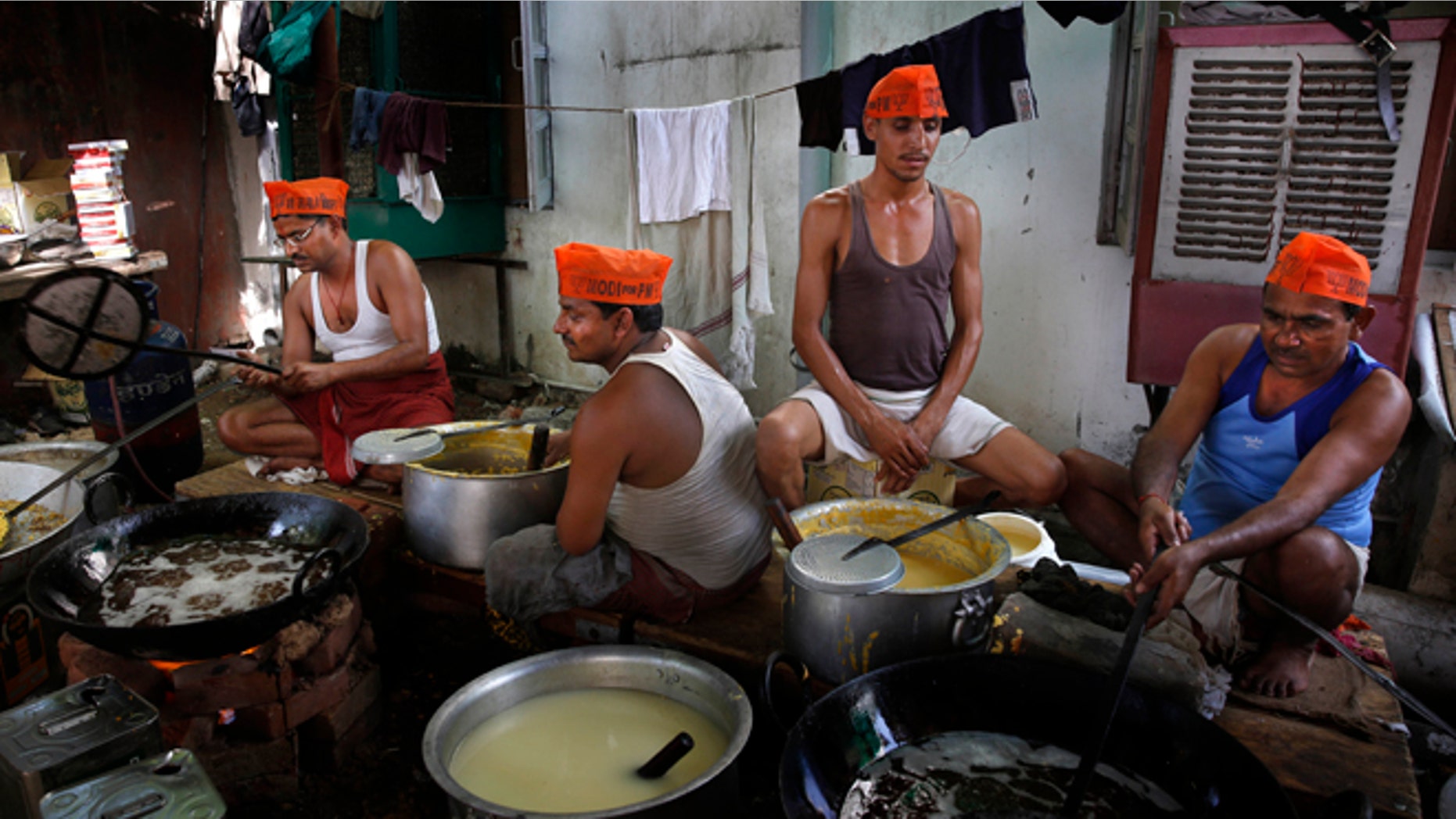 May 15, 2014: Indian workers prepare sweets anticipating election victory for the Bharatiya Janata Party (BJP) at the partys headquarters, in New Delhi, India.