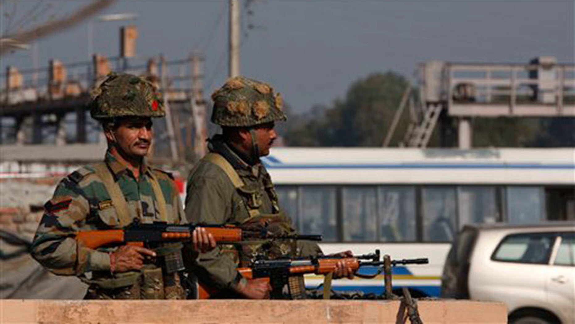 Jan. 2, 2015: Indian soldiers stand outside an Indian air force base in Pathankot, 267 miles north of New Delhi, India