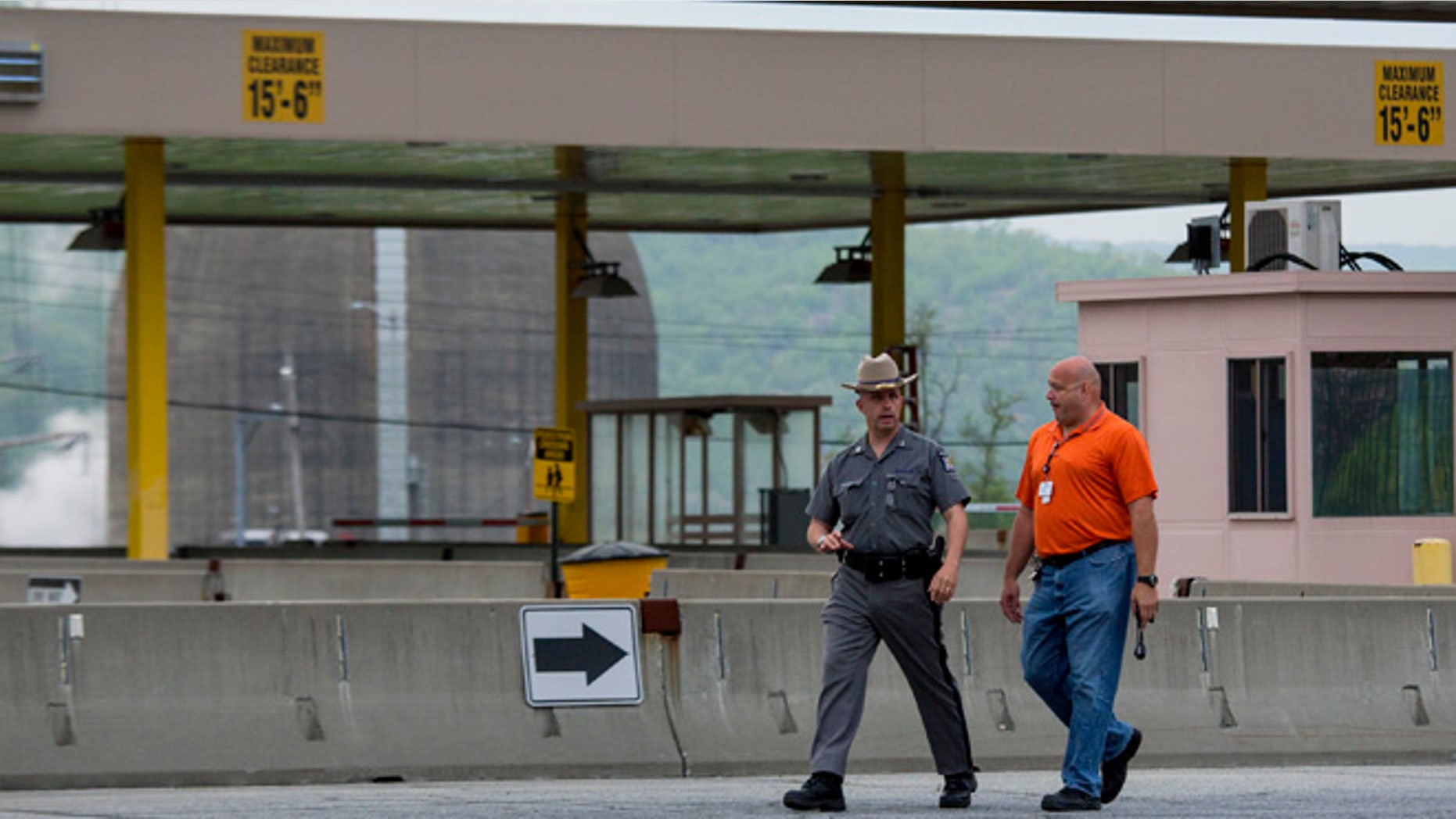 May 9, 2015: Police and security officials move about the Indian Point nuclear power plant after a transformer failed, causing a fire that has been extinguished in Buchanan, N.Y.