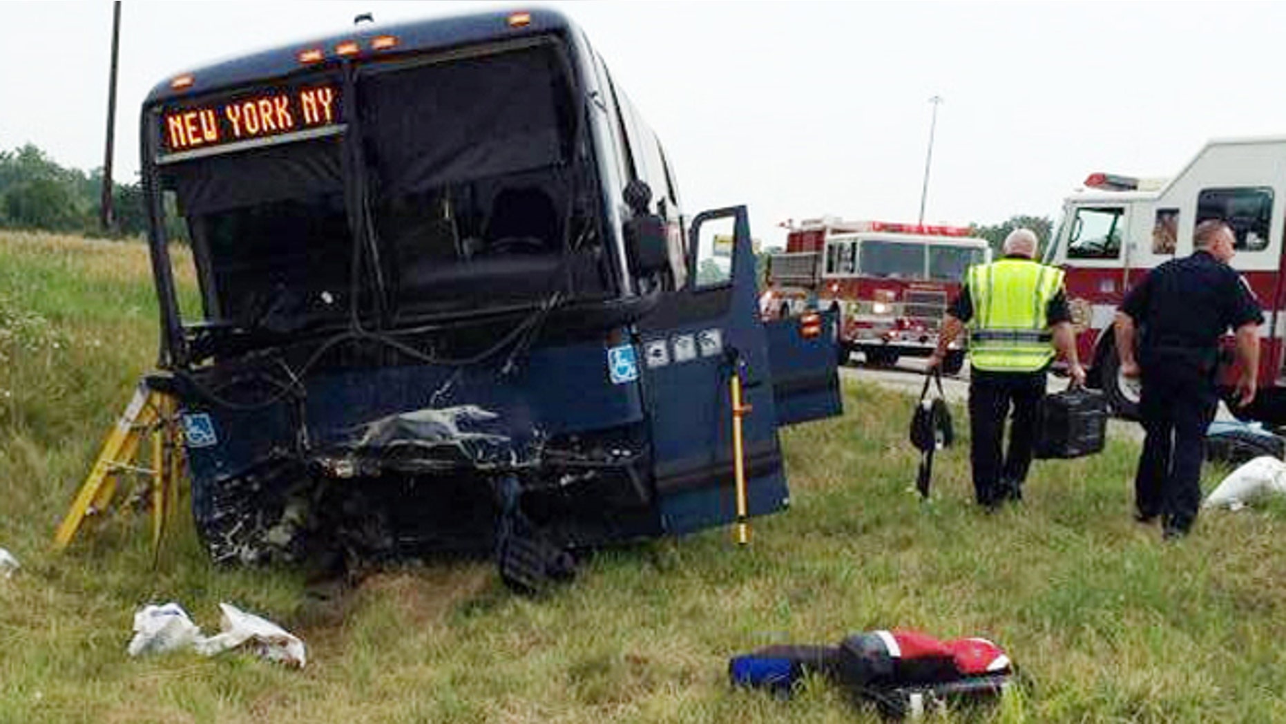 July 13, 2014: This Photo provided by the Wayne County, Indiana Sheriffs Office, emergency personnel respond to the scene of a bus accident on interstate 70 near Richmond, Ind. Authorities say a Greyhound bus and car collided on the highway near Indiana's border with Ohio, killing one person and injuring at least 18 others.