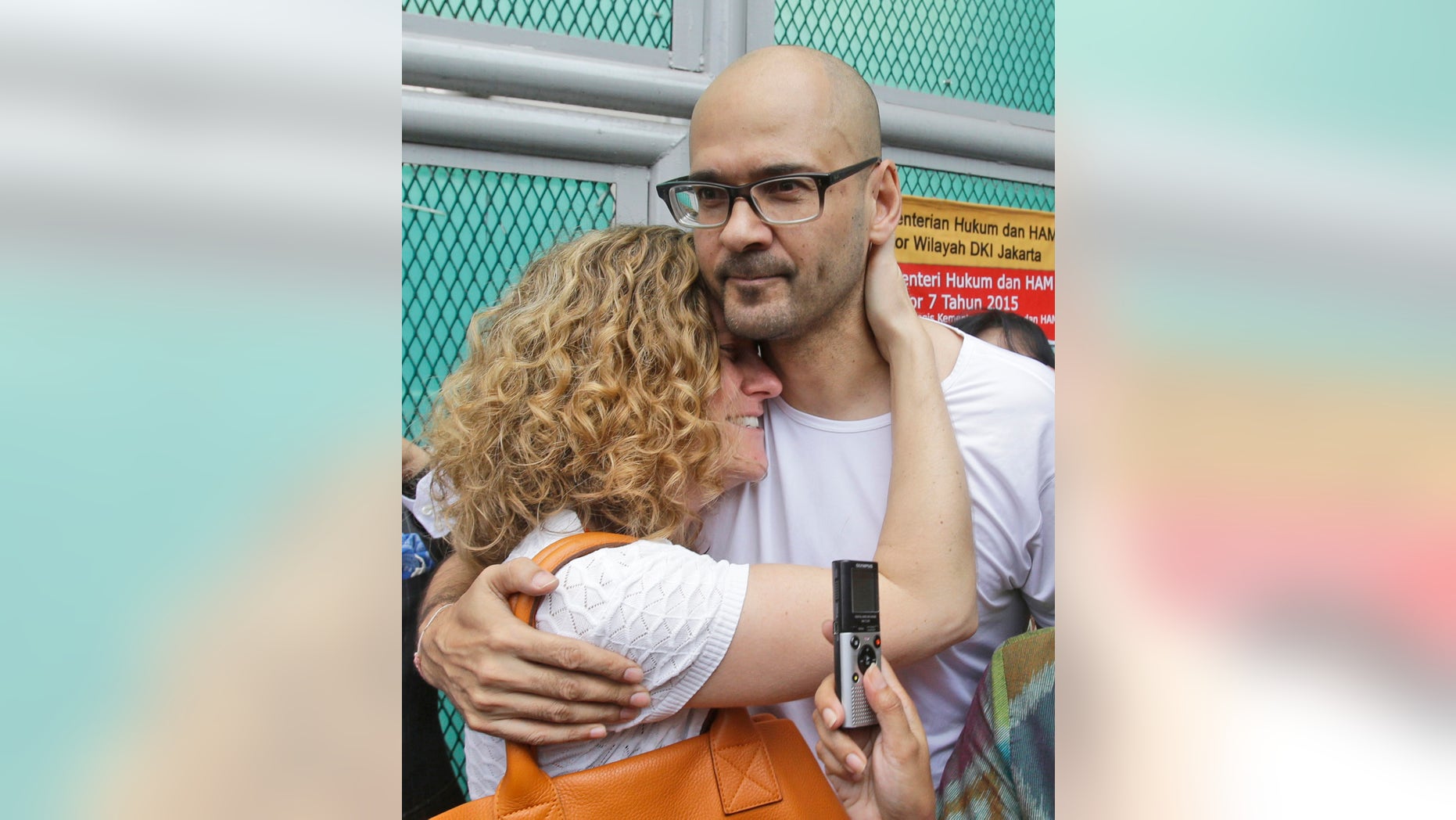 Aug. 14, 2015: Canadian teacher Neil Bantleman, right, hugs his wife Tracy, left, after he was released from Cipinang prison in Jakarta, Indonesia. (AP)