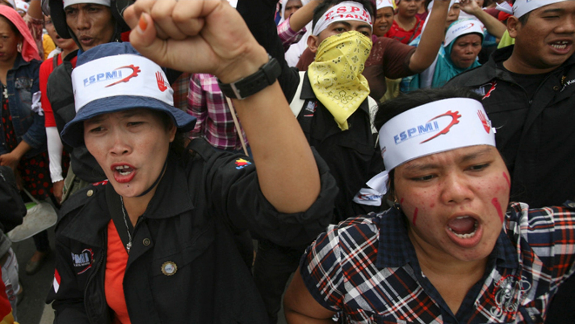 Oct. 3, 2012: Factory workers shout slogans during a protest in medan, North Sumatra, Indonesia.